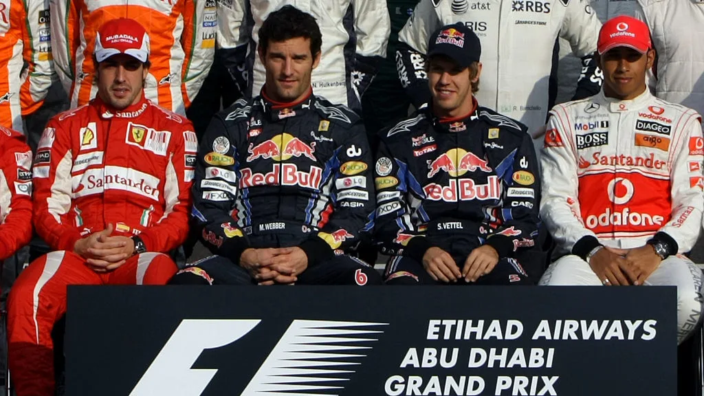 ( L TO R) Ferrari's Spanish driver Fernando Alonso, Red Bull's Australian driver Mark Webber, Red