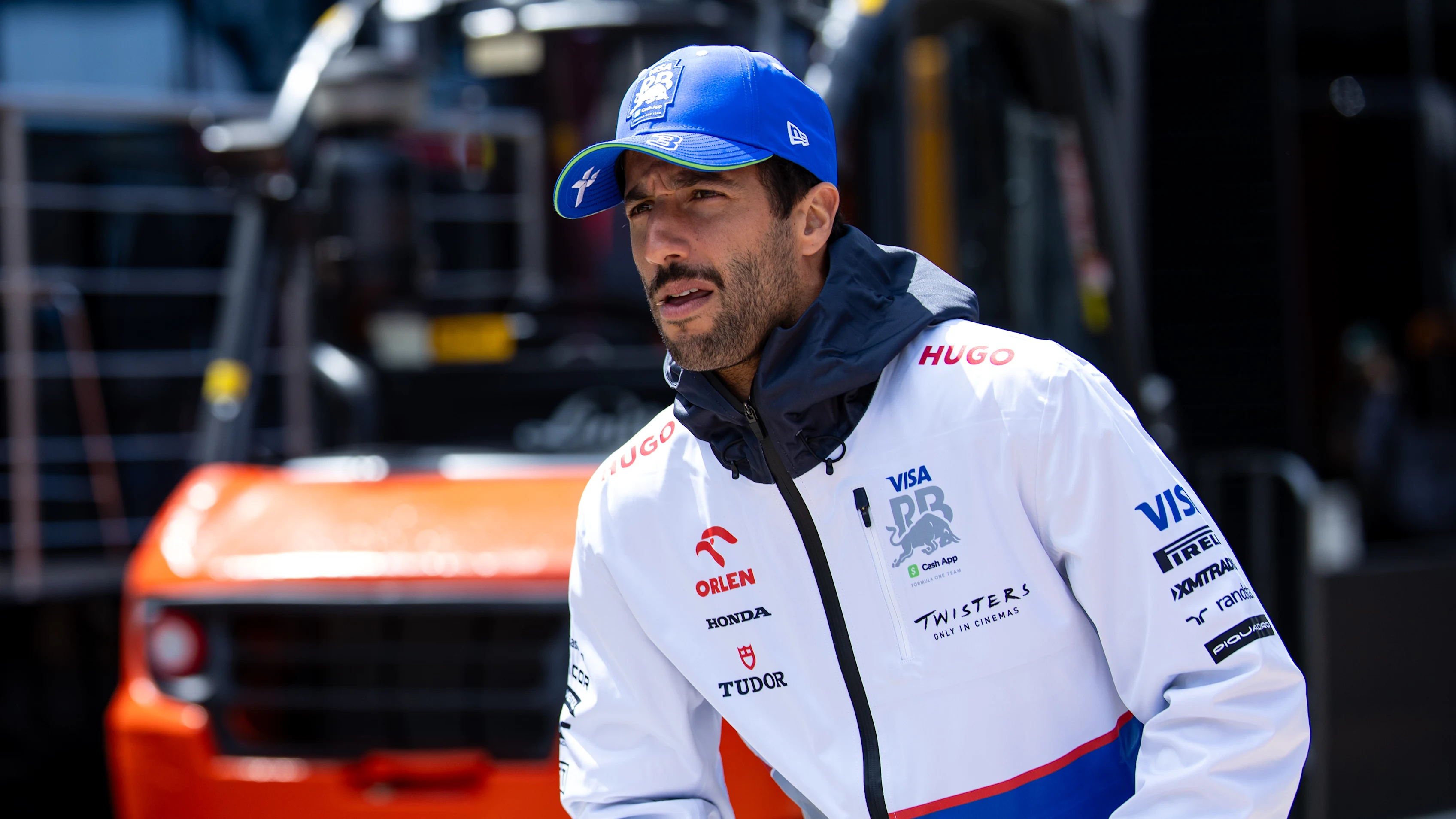 NORTHAMPTON, ENGLAND - JULY 4: Daniel Ricciardo of Australia and Visa Cash App RB rides a scooter