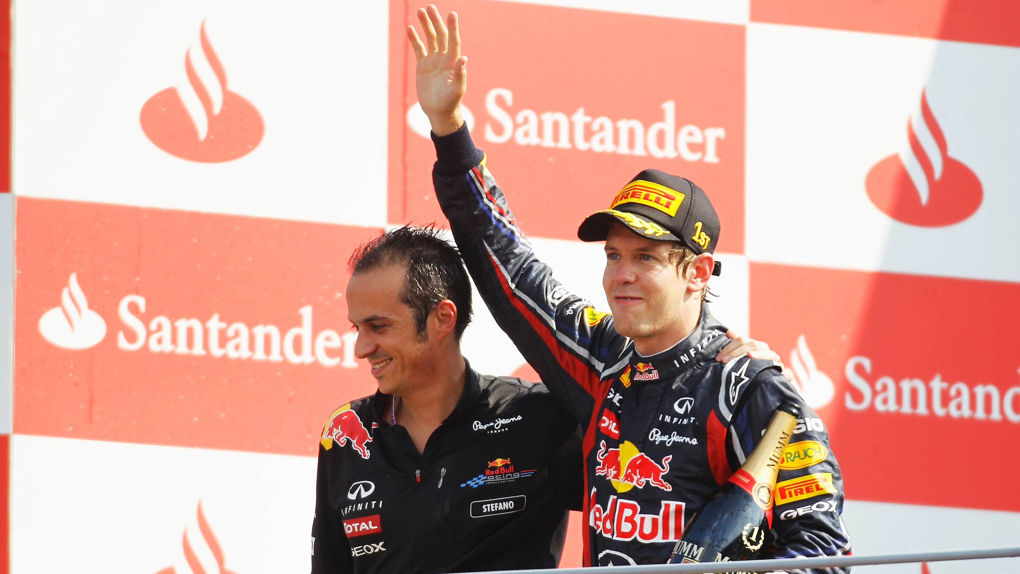 MONZA, ITALY - SEPTEMBER 11:  Sebastian Vettel (R) of Germany and Red Bull Racing celebrates on the
