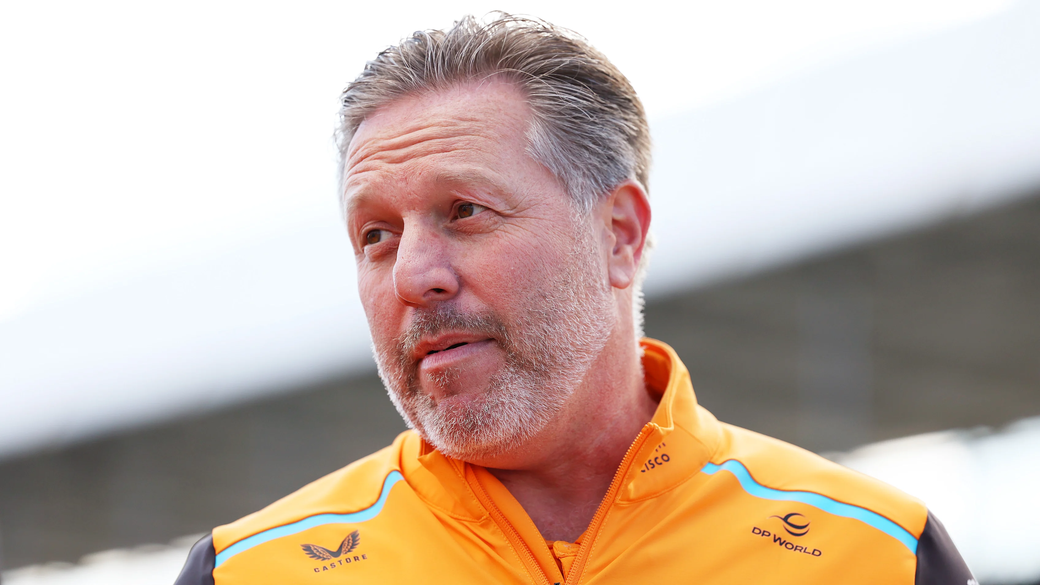 NORTHAMPTON, ENGLAND - JULY 06: McLaren Chief Executive Officer Zak Brown walks on the grid prior
