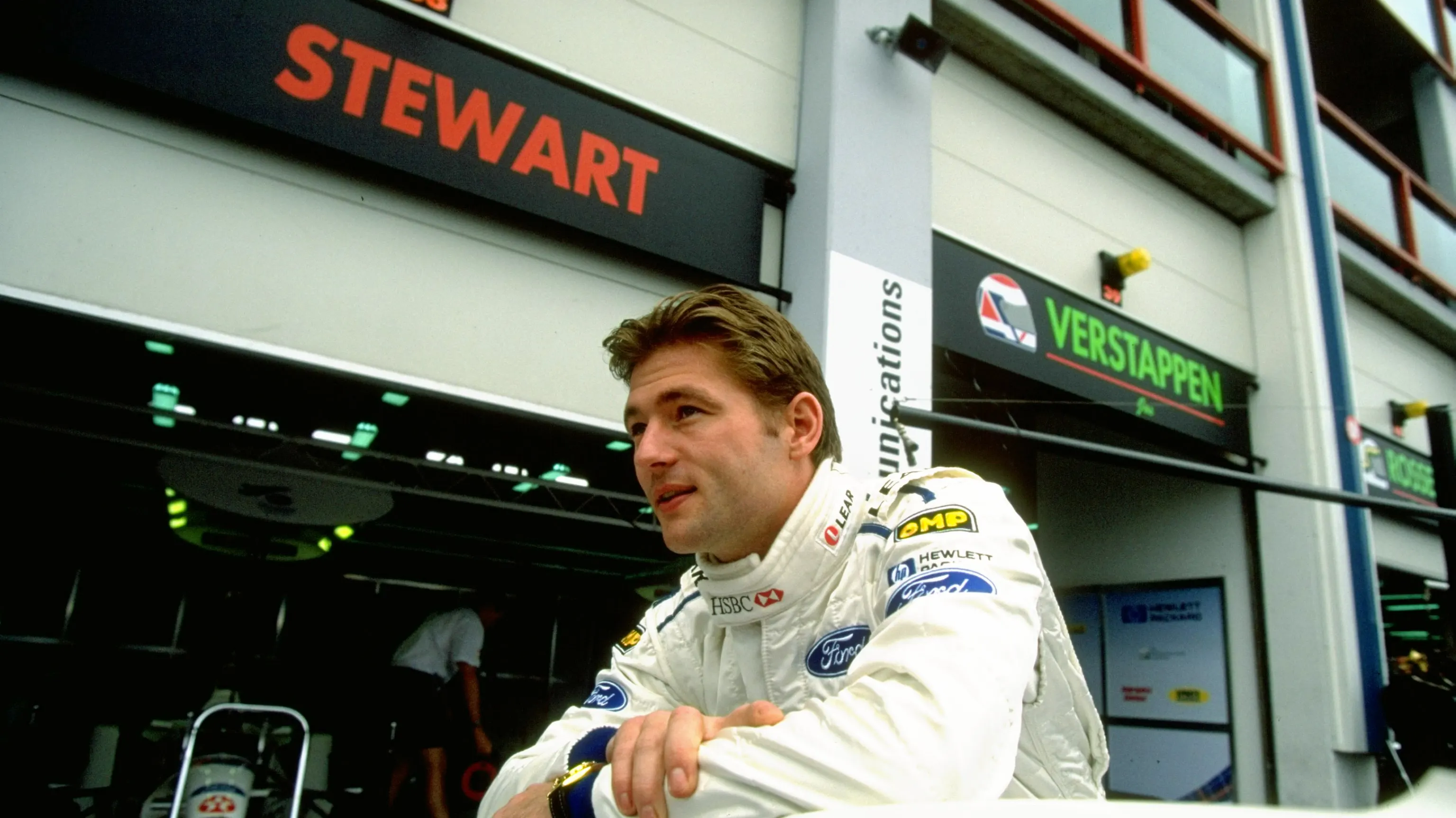 28 Jun 1998:  Jos Verstappen of Holland leans on his Stewart-Ford outside the garage during the