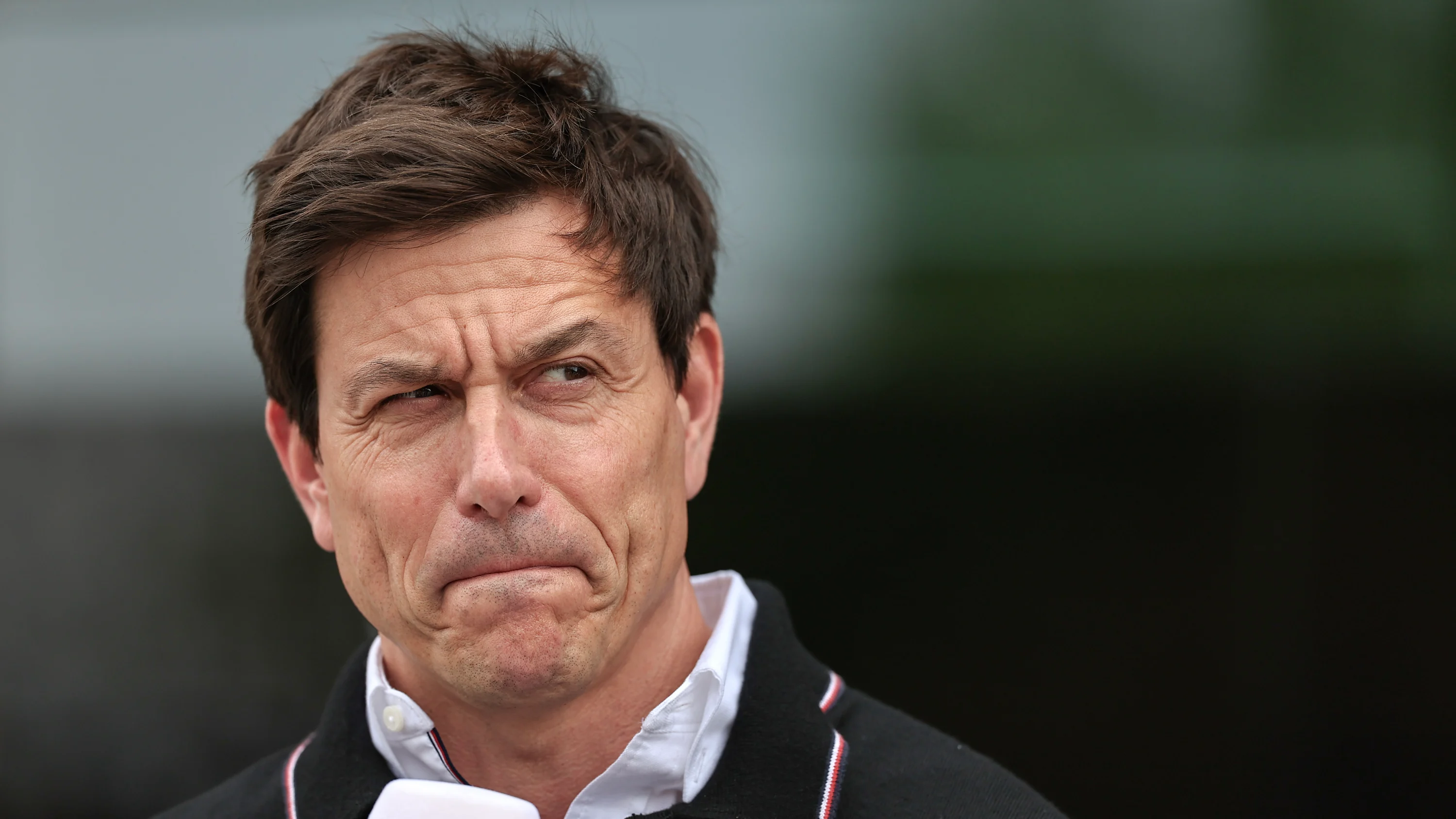 Mercedes' Austrian team principal and CEO Toto Wolff listens during the third practice session for