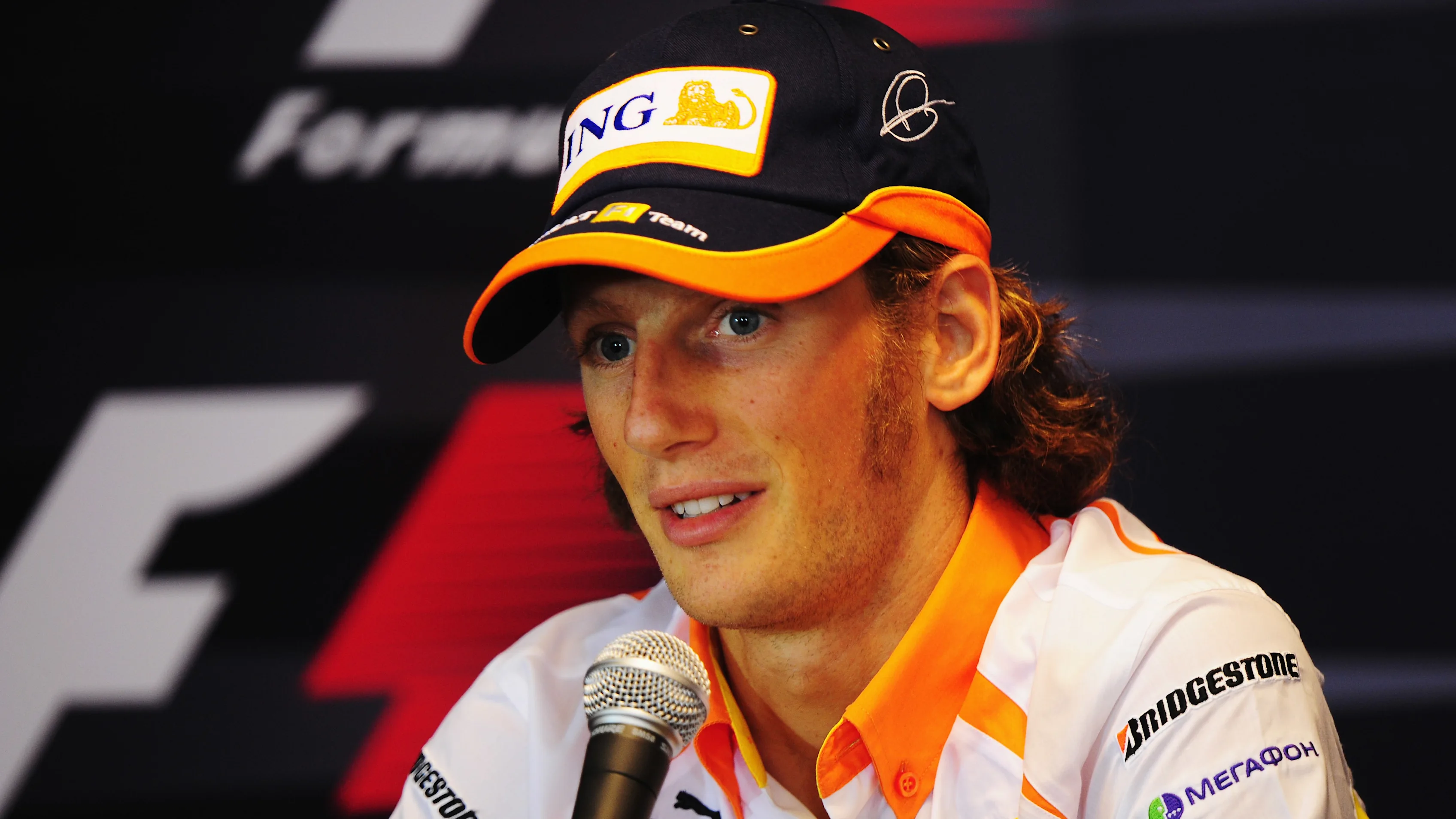 SPA FRANCORCHAMPS, BELGIUM - AUGUST 27:  Romain Grosjean of France and Renault talks at the drivers