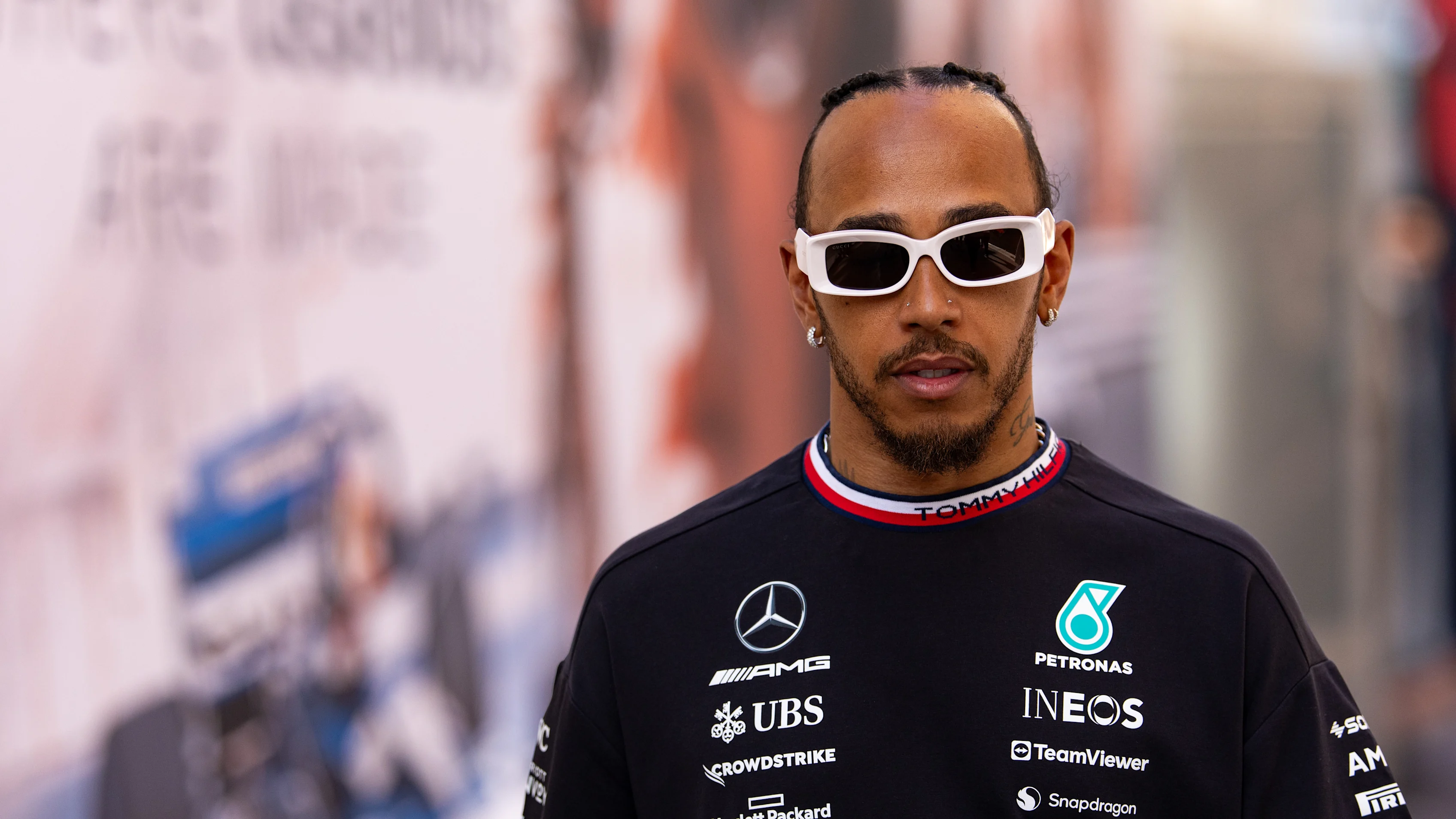 MONTE-CARLO, MONACO - MAY 25: Lewis Hamilton of Great Britain and Mercedes walks in the paddock