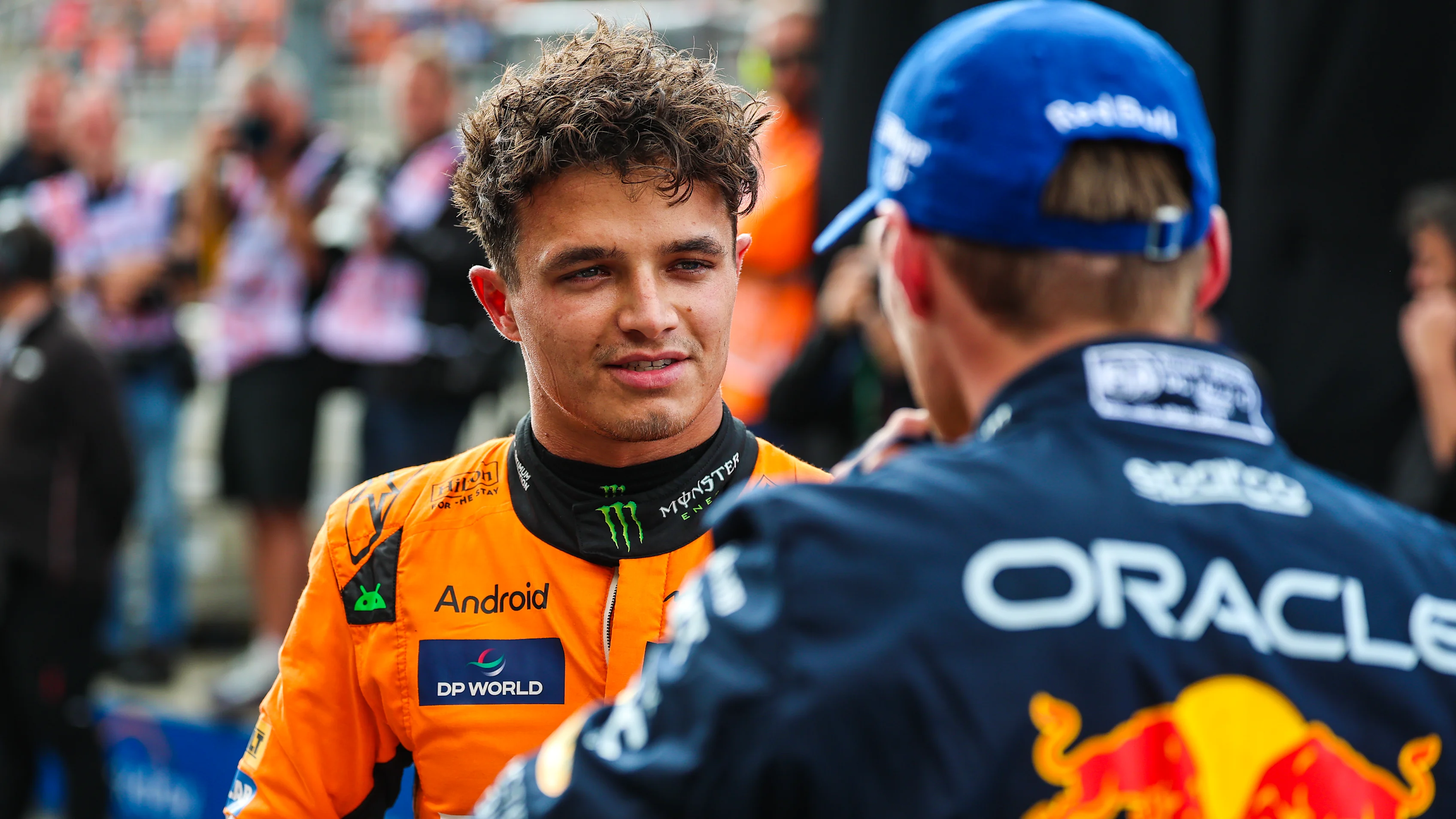 ZANDVOORT, NETHERLANDS - AUGUST 24: Lando Norris of Great Britain and McLaren and Max Verstappen of