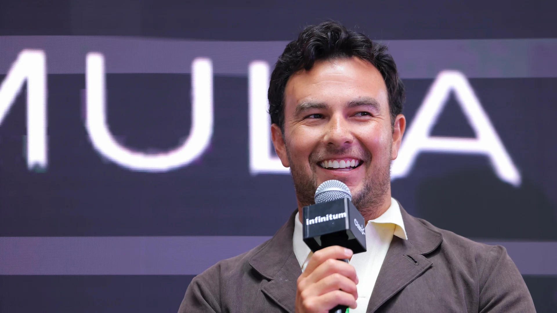 MEXICO CITY, MEXICO - AUGUST 27: Driver Sergio Perez addresses the media after announcing his
