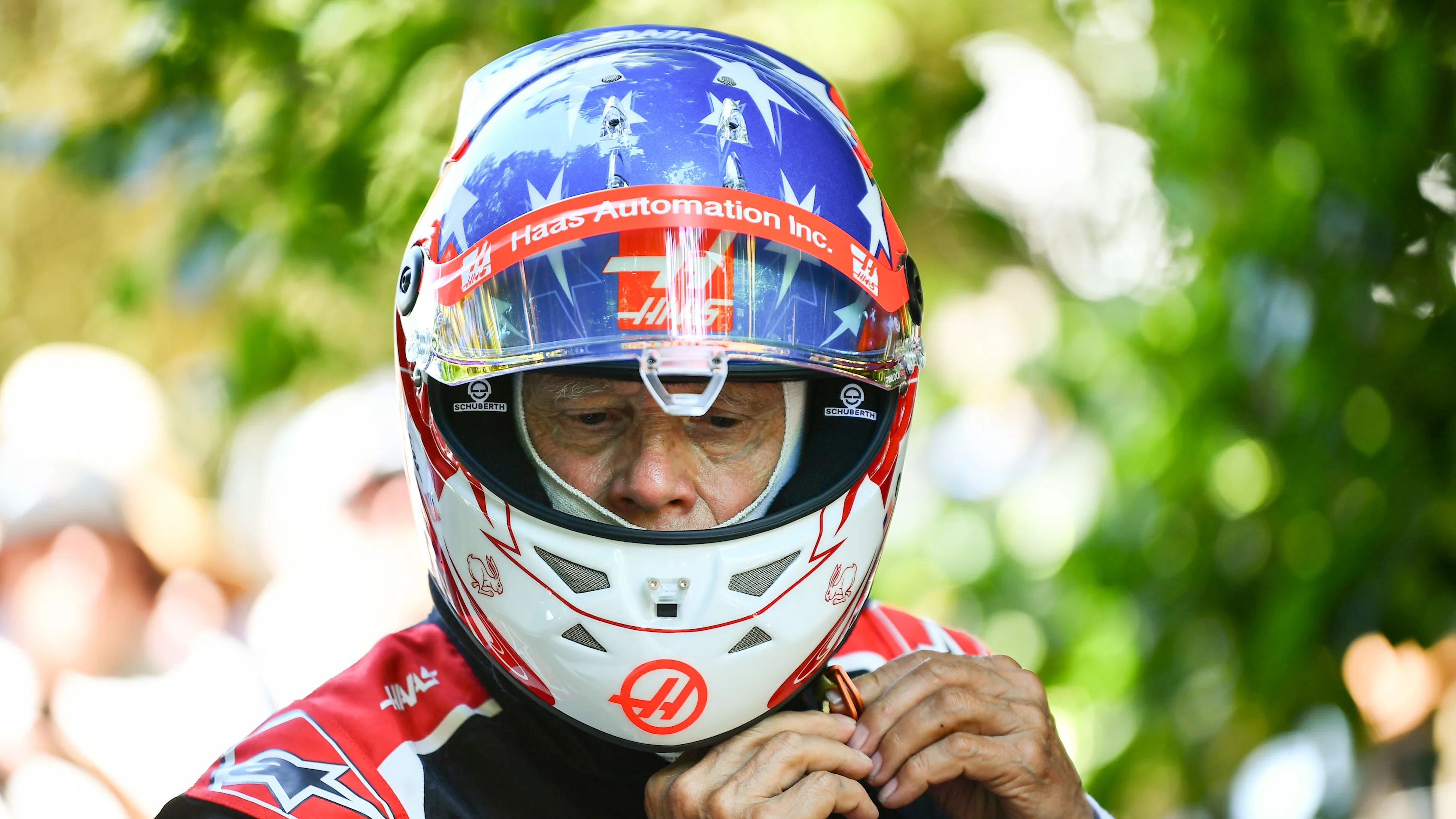 Haas gets ready to drive one of the F1 cars that bears his name