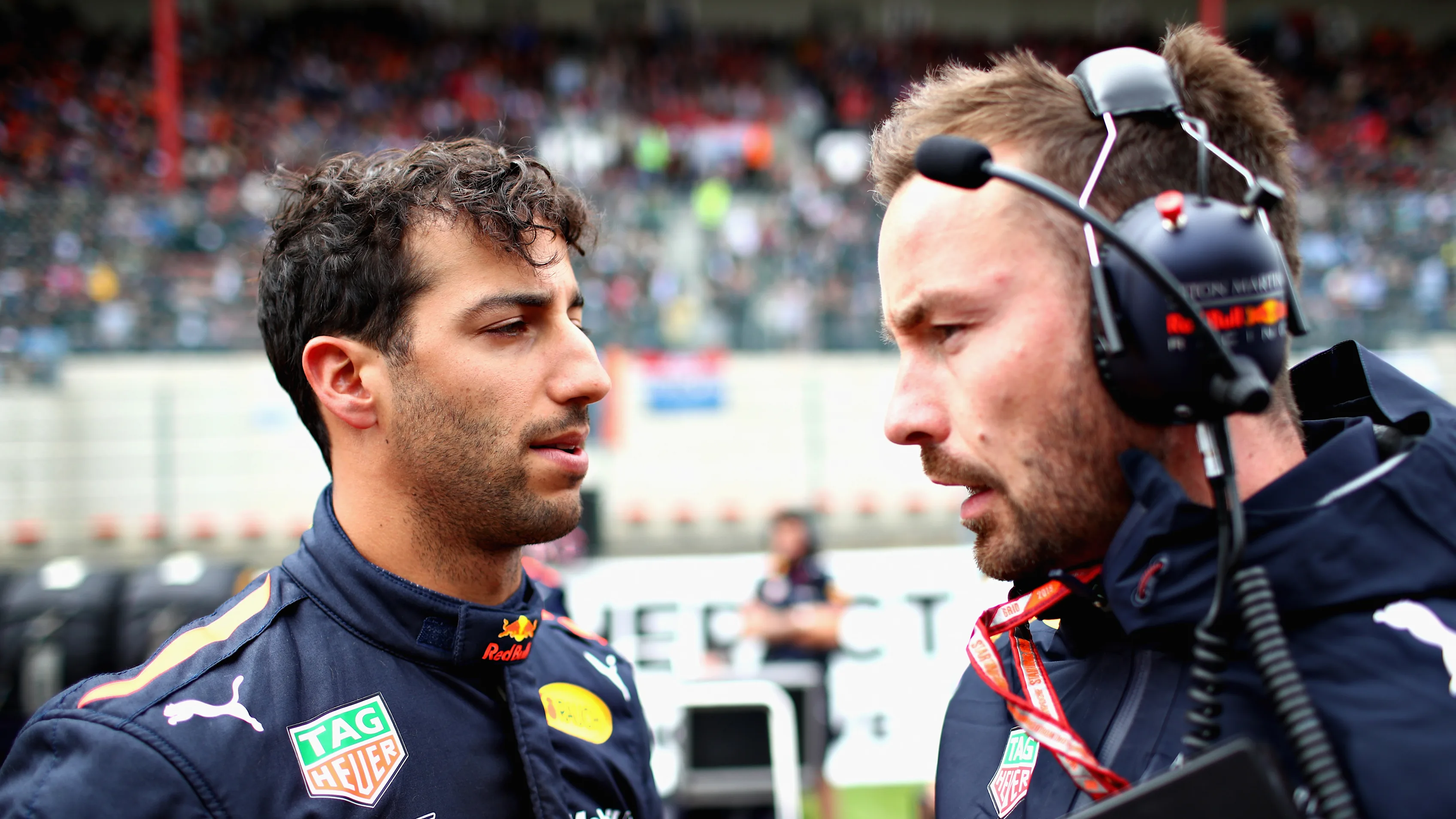 SPA, BELGIUM - AUGUST 26: Daniel Ricciardo of Australia and Red Bull Racing talks with race