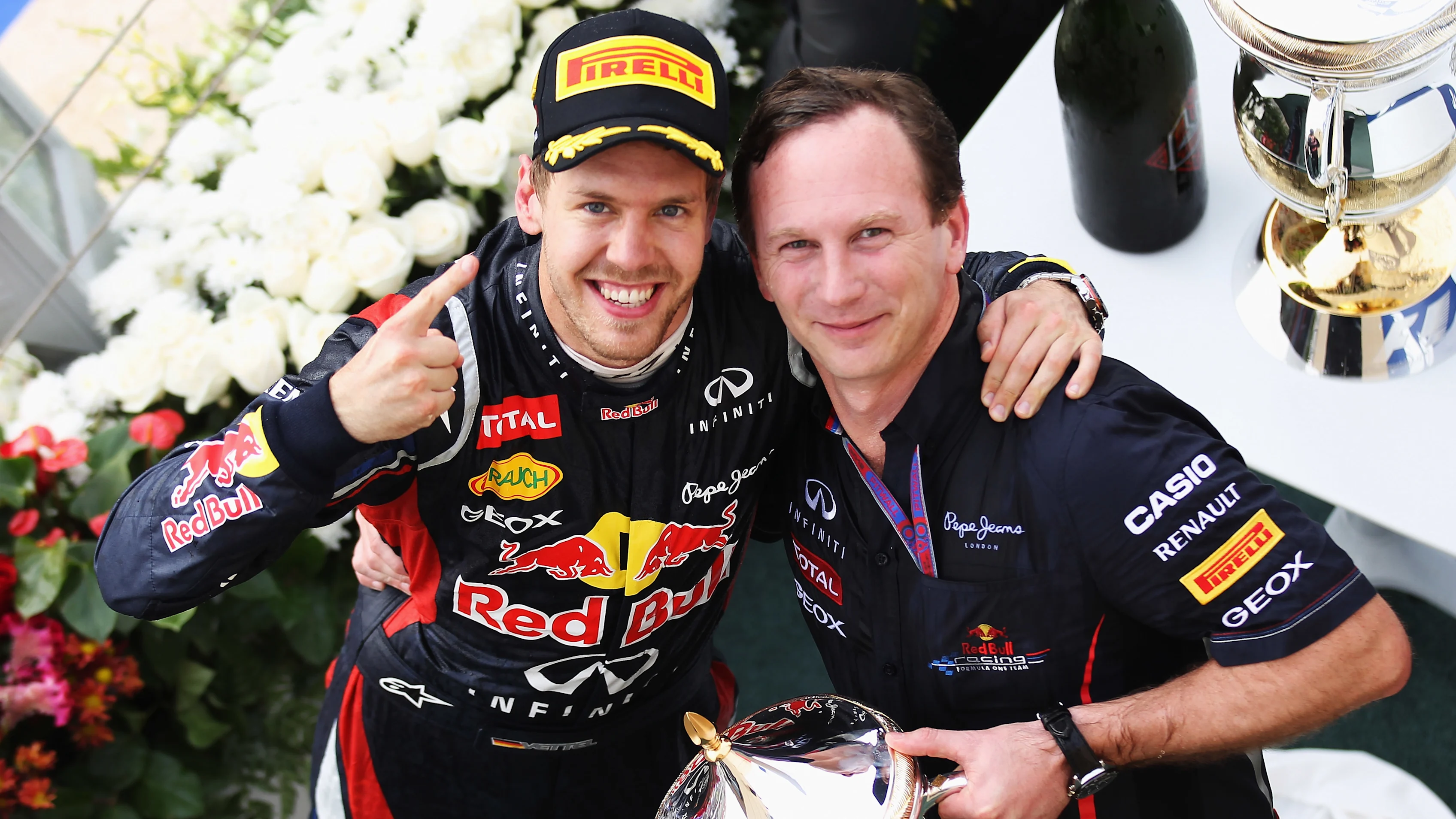 SAKHIR, BAHRAIN - APRIL 22:  Sebastian Vettel (L) of Germany and Red Bull Racing celebrates on the
