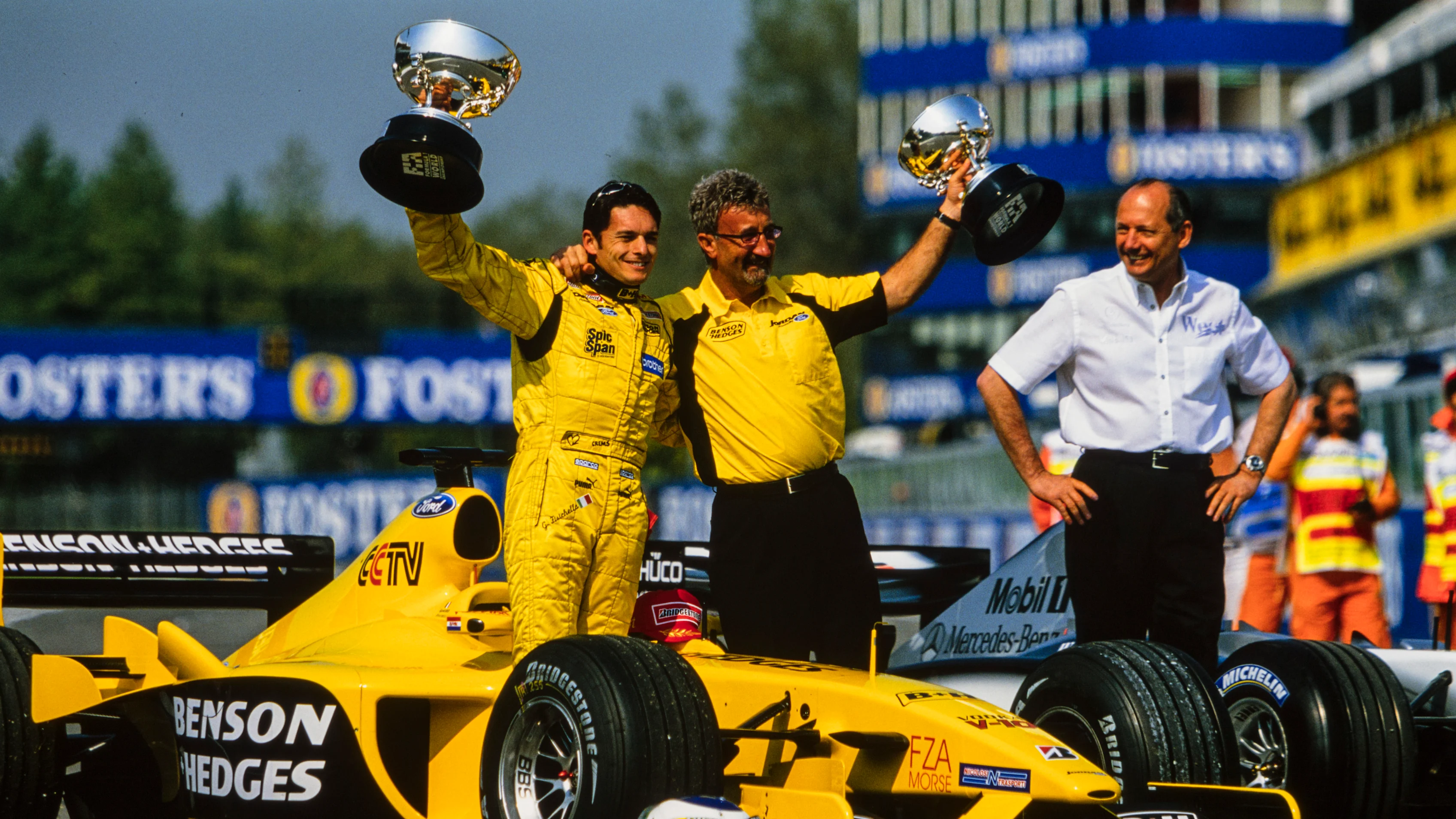 IMOLA, ITALY - APRIL 20: Giancarlo Fisichella is awarded the winner's trophy alongside Eddie Jordan