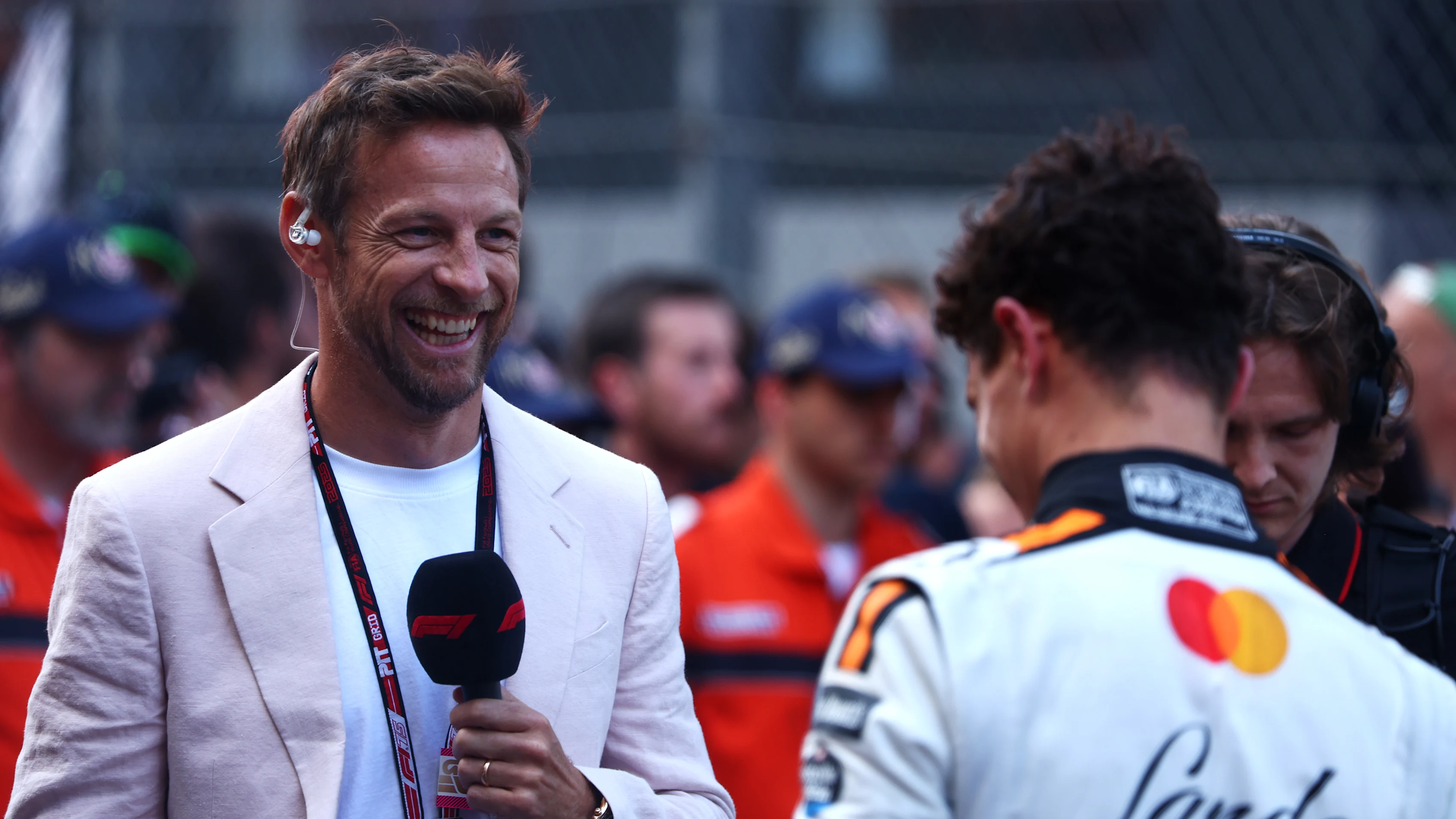 MONTE-CARLO, MONACO - MAY 25: Jenson Button interviews Race winner Lando Norris of Great Britain
