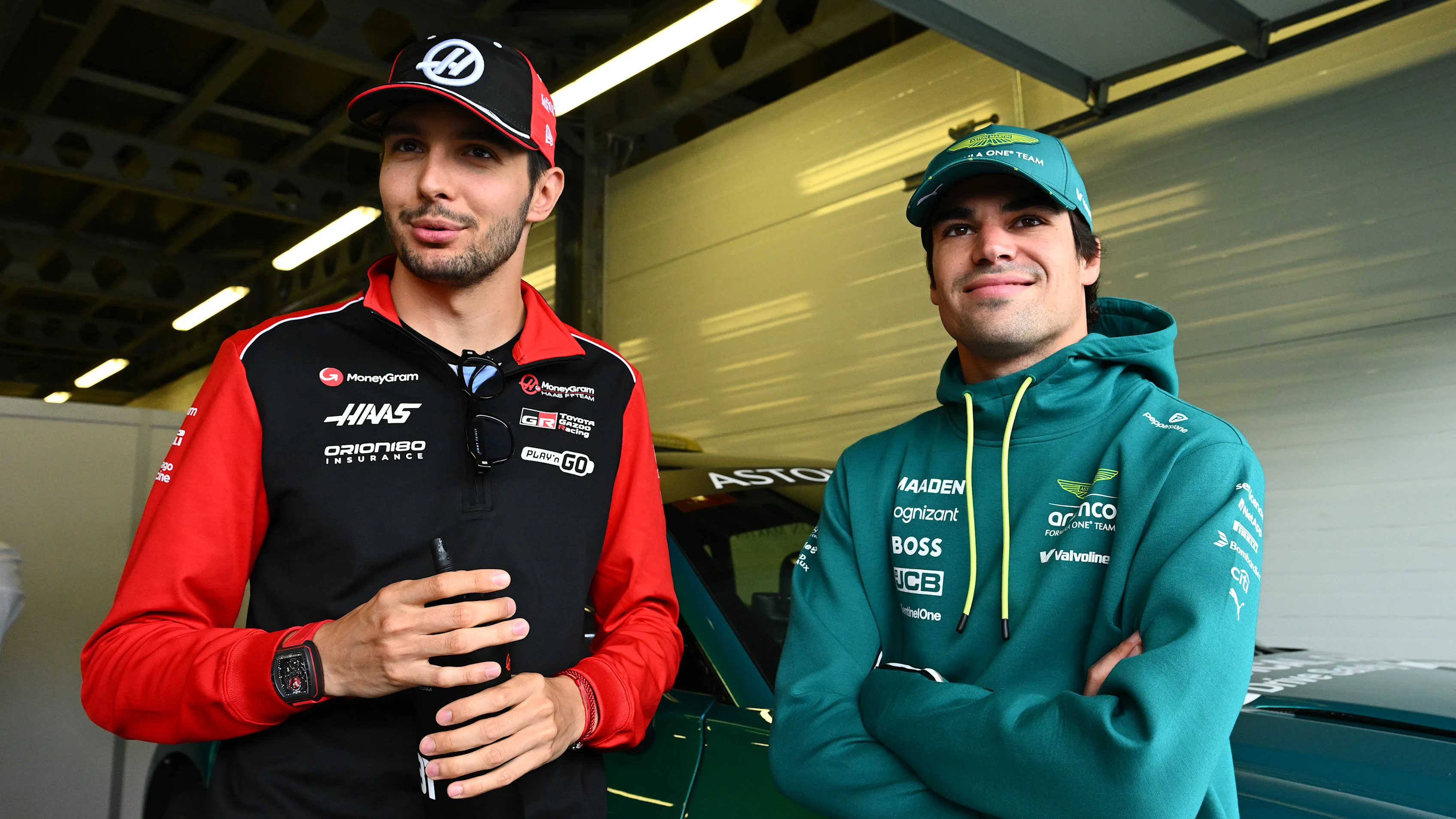 BAKU, AZERBAIJAN - SEPTEMBER 21: Esteban Ocon of France and Haas F1 and Lance Stroll of Canada and