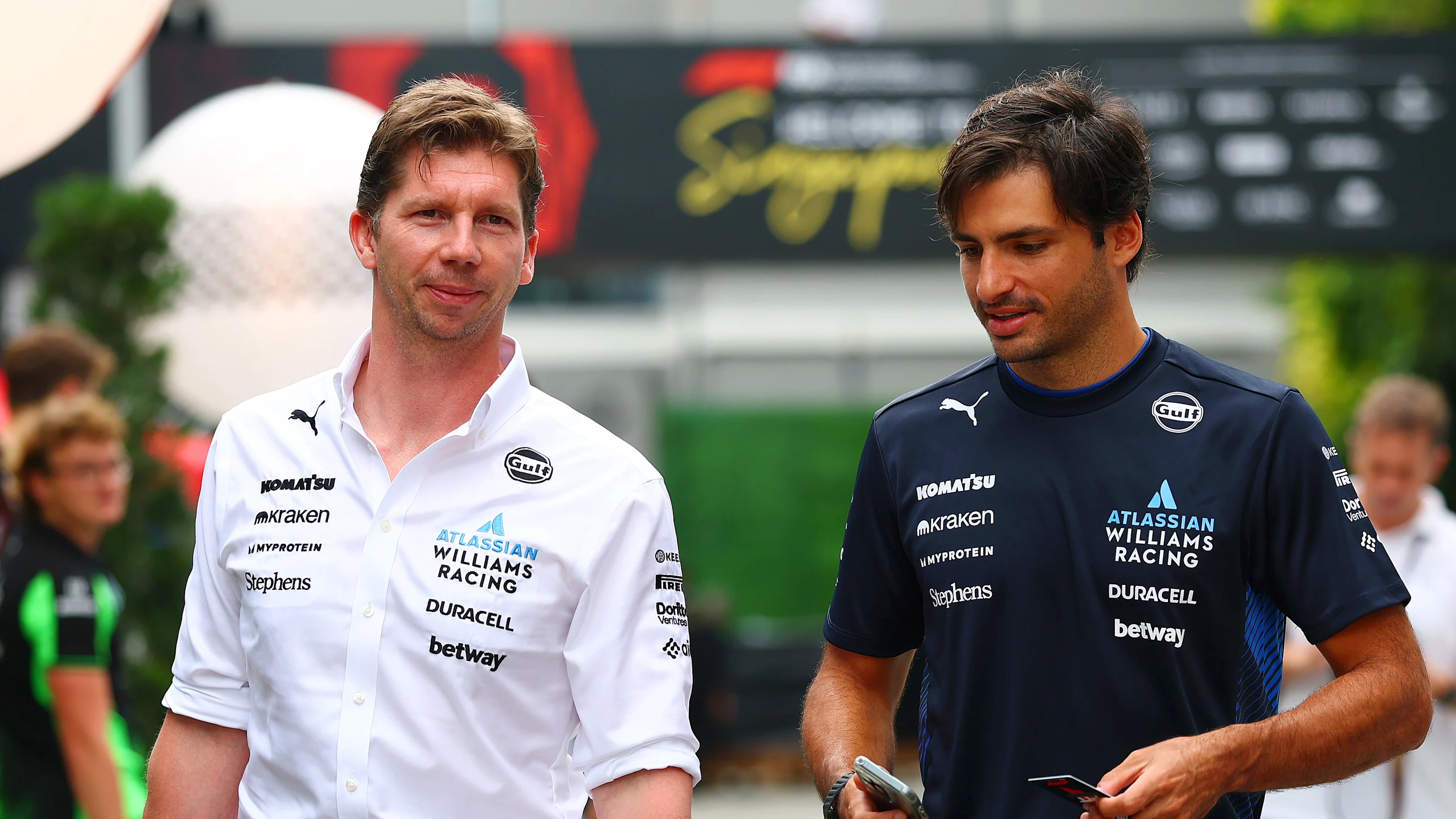 SINGAPORE, SINGAPORE - OCTOBER 03: James Vowles, Team Principal of Williams and Carlos Sainz of