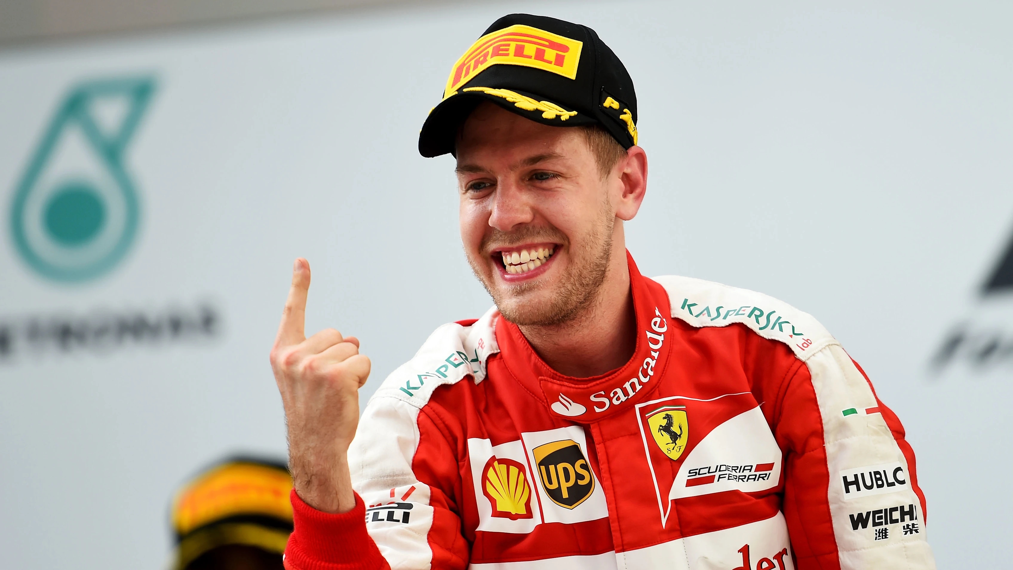 KUALA LUMPUR, MALAYSIA - MARCH 29:  Sebastian Vettel of Germany and Ferrari celebrates on the