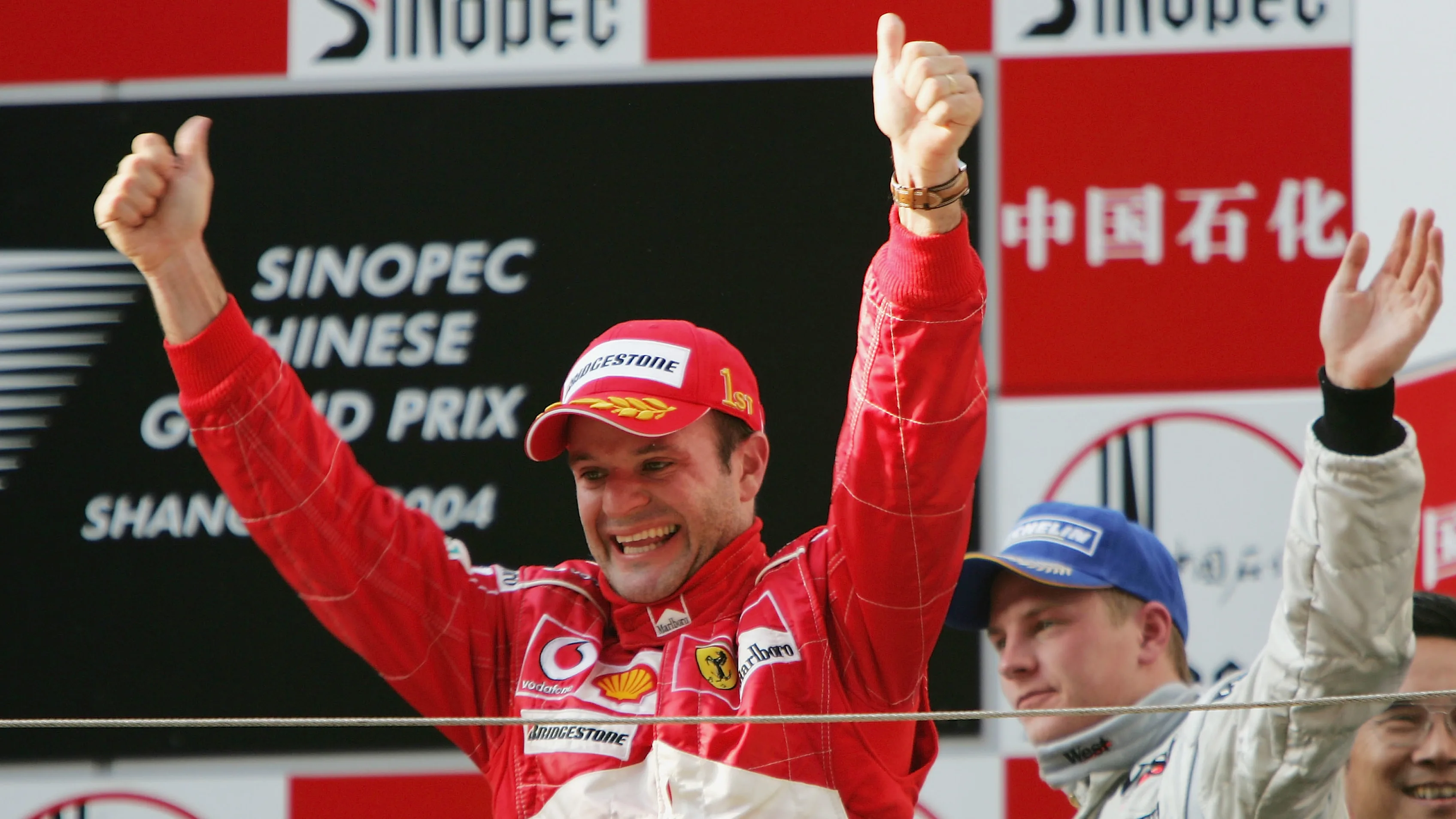 SHANGHAI, CHINA - SEPTEMBER 26:  Rubens Barrichello of Brazil and Ferrari celebrates winning the