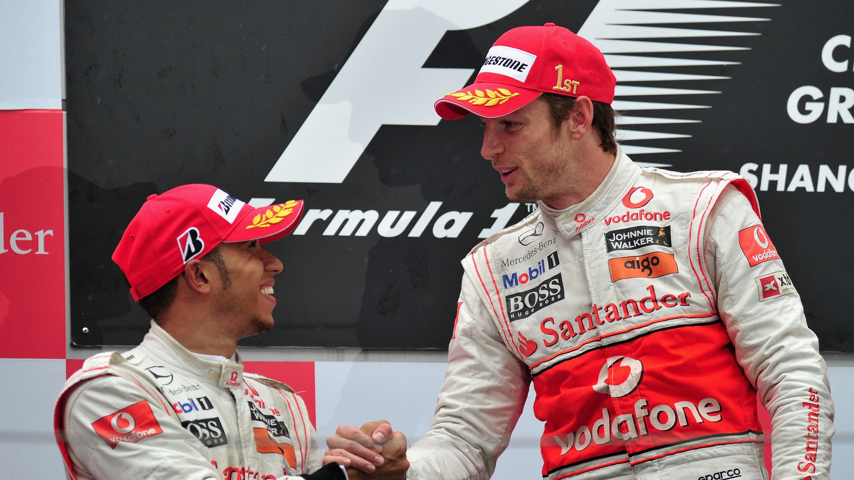 SHANGHAI, CHINA - APRIL 18:  Race winner Jenson Button (R) of Great Britain and McLaren Mercedes is