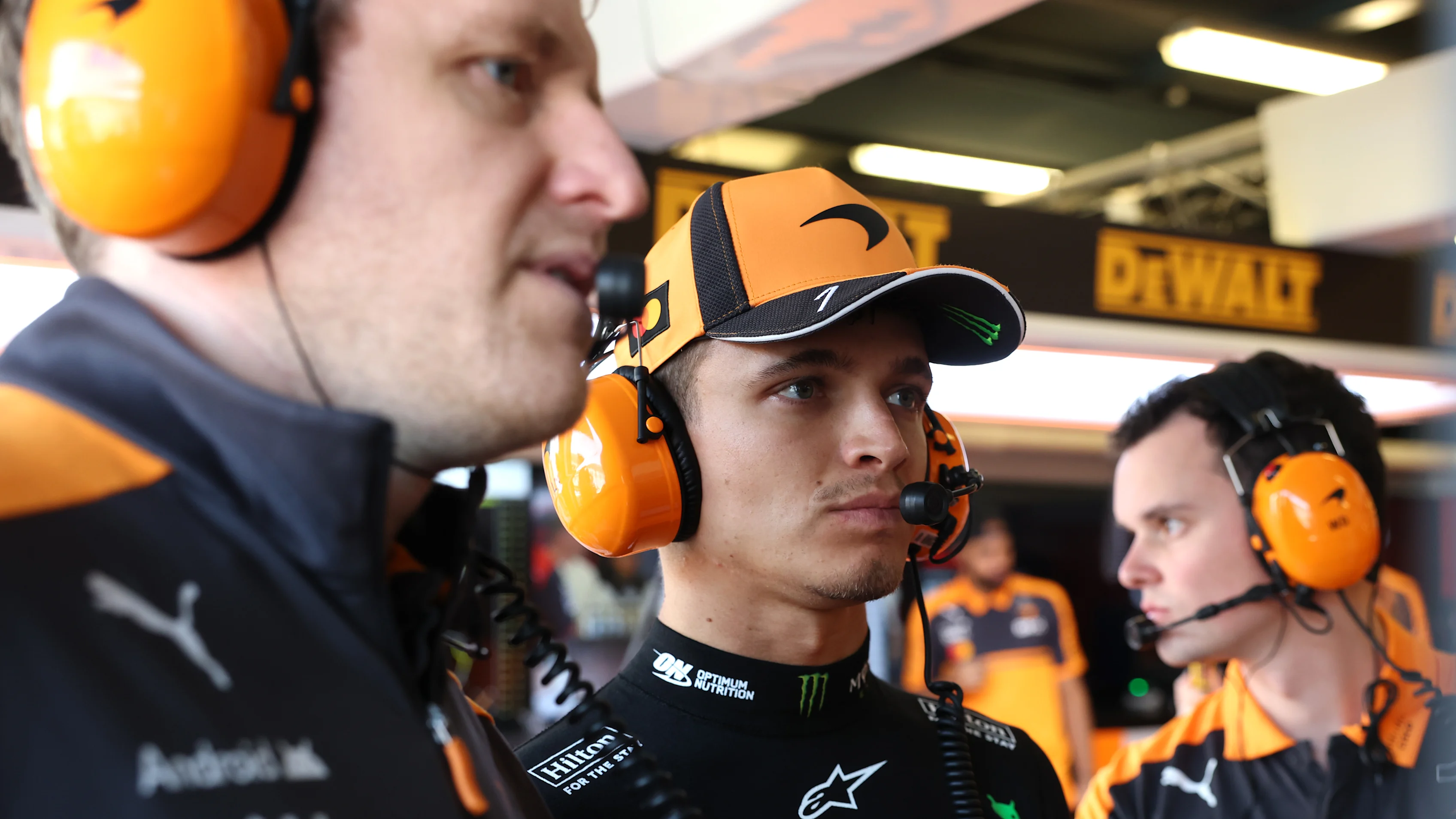 MELBOURNE, AUSTRALIA - MARCH 07: Lando Norris of Great Britain and McLaren with engineers in the