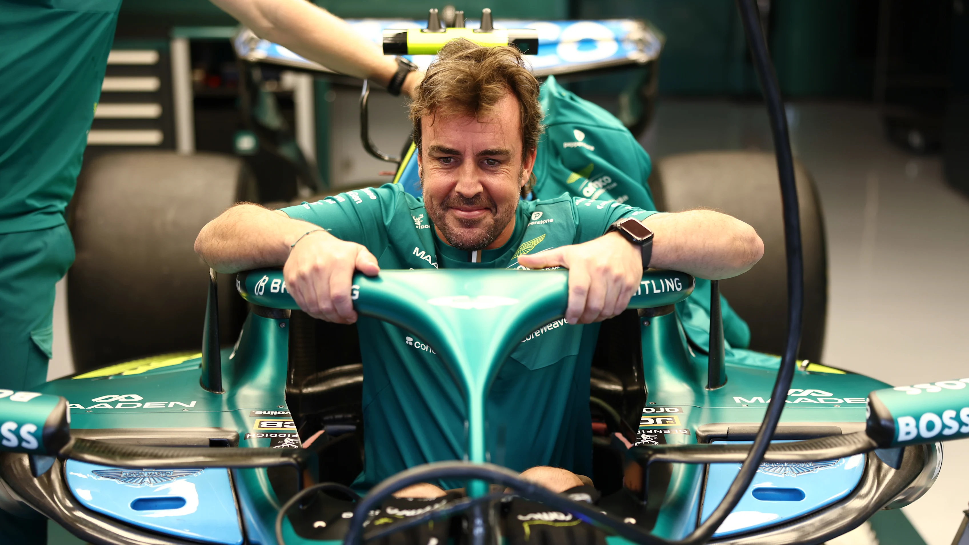 SPIELBERG, AUSTRIA - JUNE 25: Fernando Alonso of Spain and Aston Martin F1 Team has a seat fit in