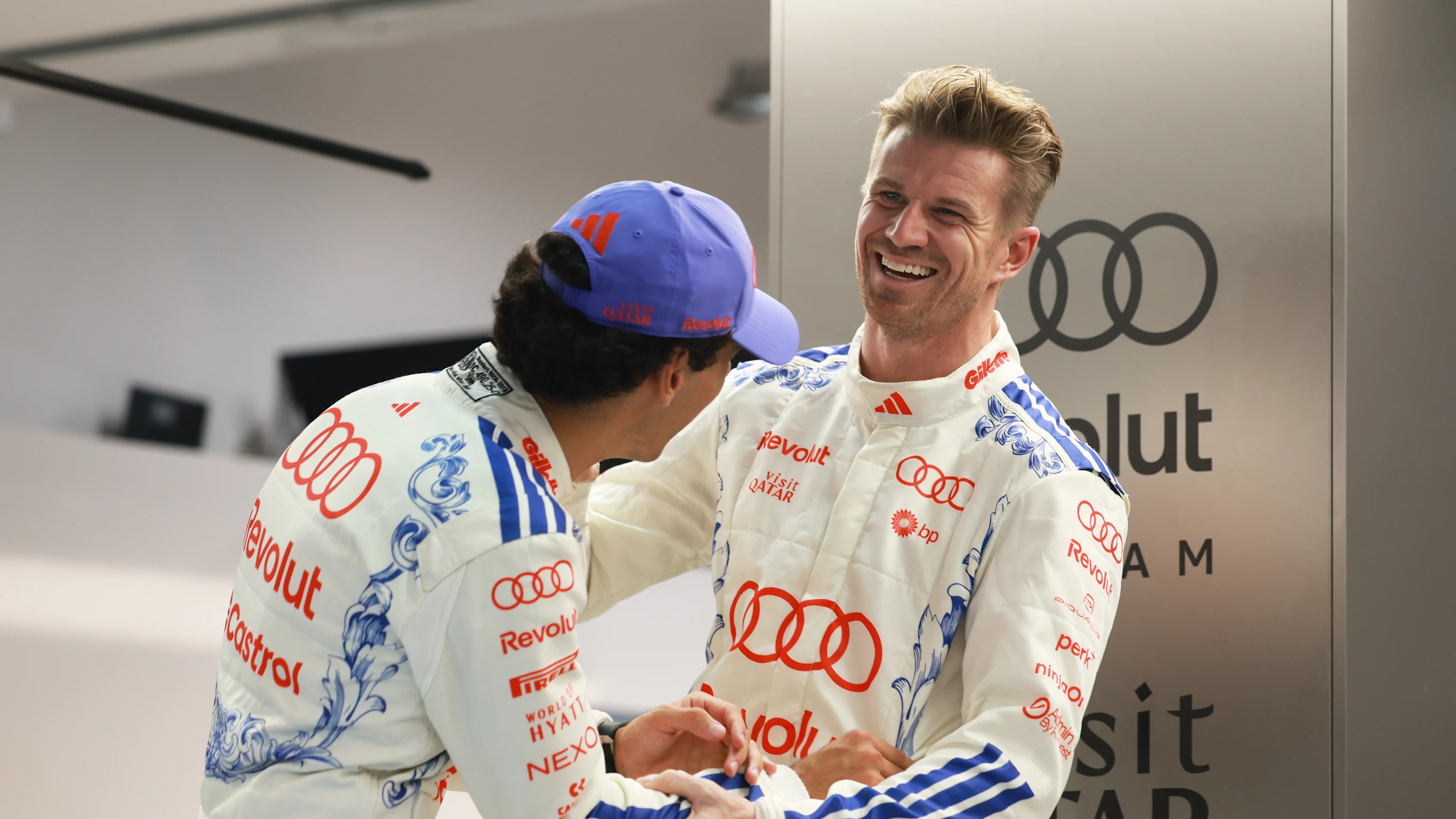 SINGAPORE, SINGAPORE - OCTOBER 08: Gabriel Bortoleto of Brazil and Audi F1 Team talks with Nico