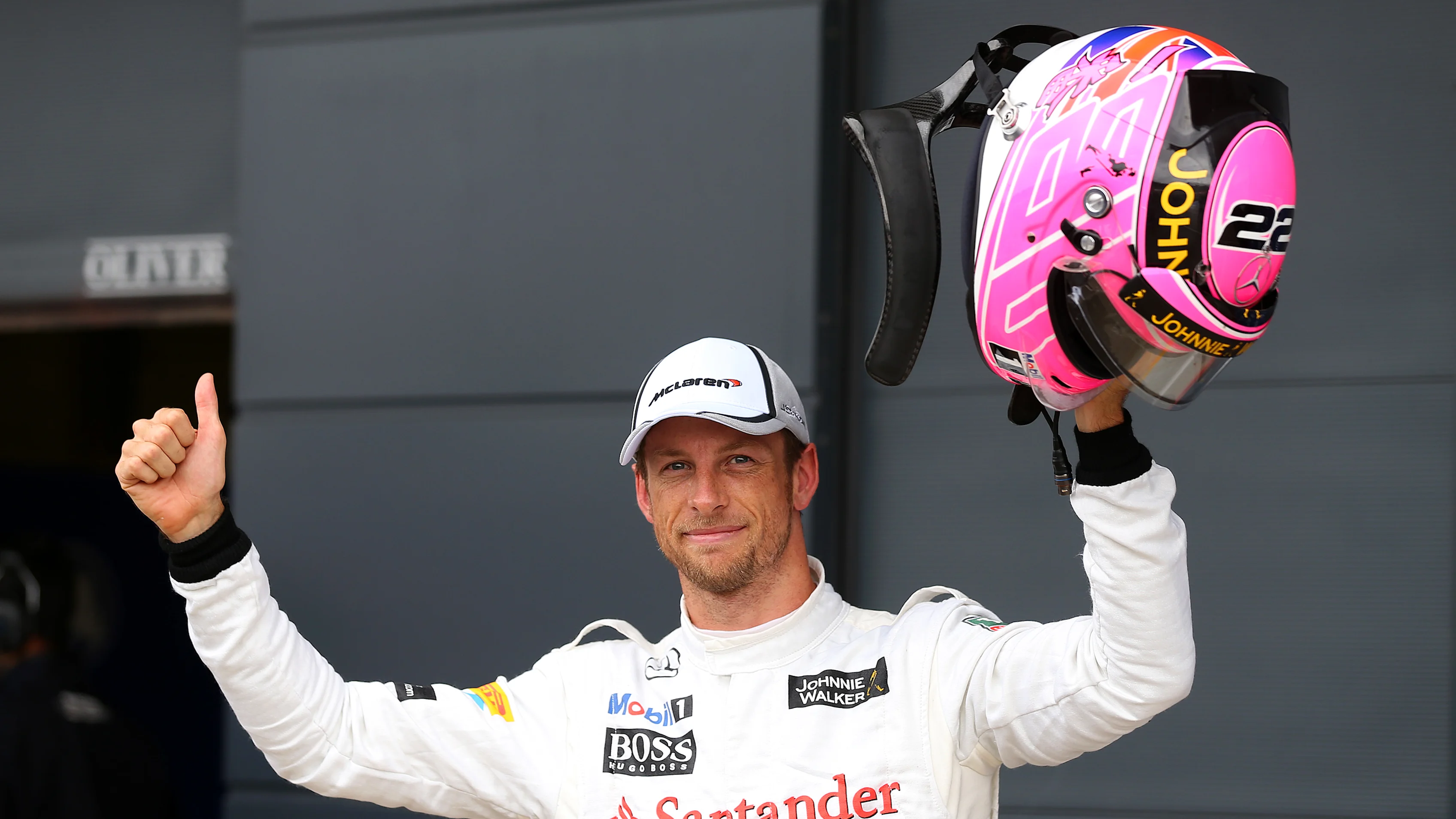 NORTHAMPTON, ENGLAND - JULY 05: Jenson Button of Great Britain and McLaren celebrates in Parc