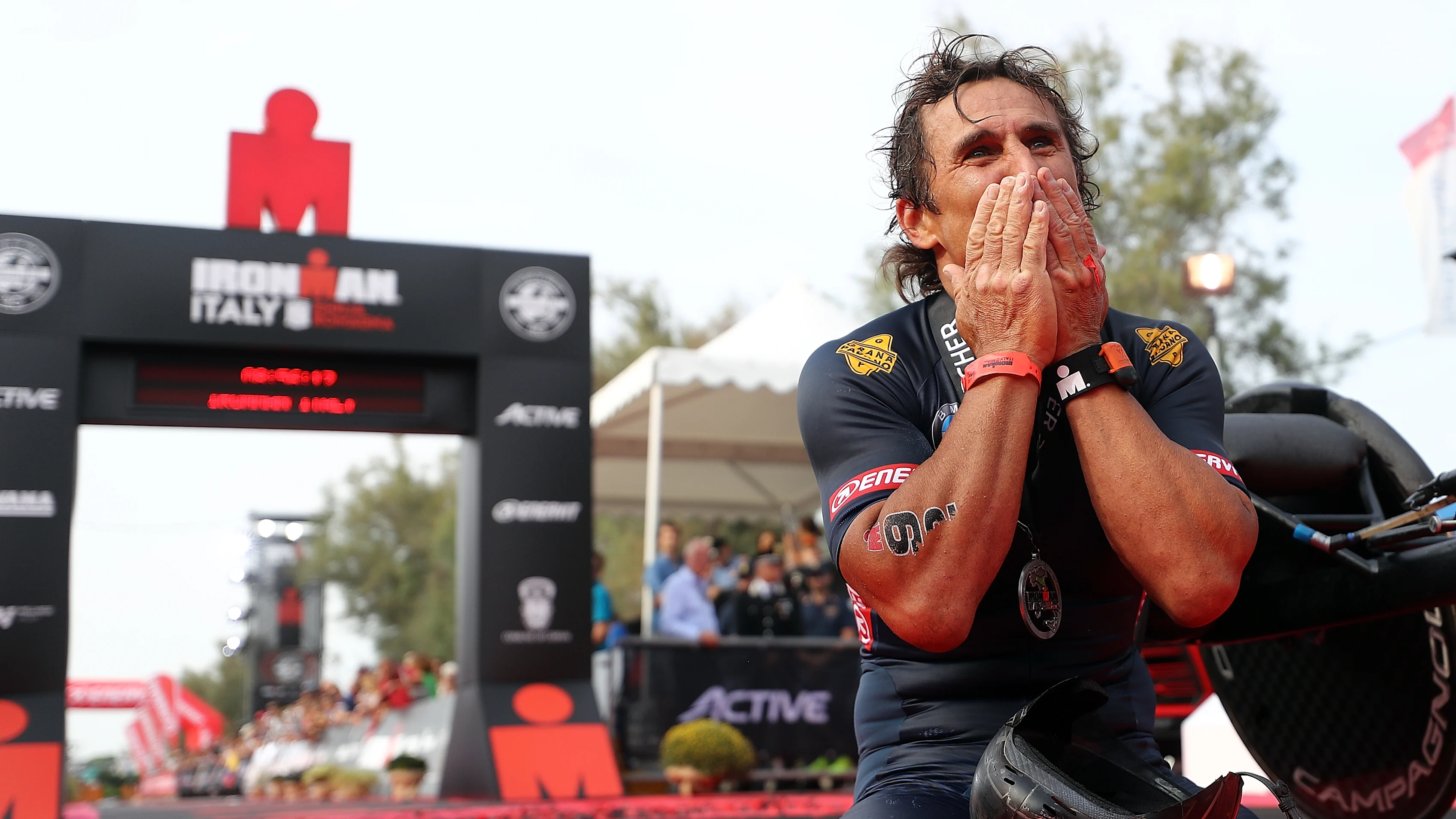 CERVIA, ITALY - SEPTEMBER 21: Alex Zanardi of Italy celebrates finishing  IRONMAN Italy on