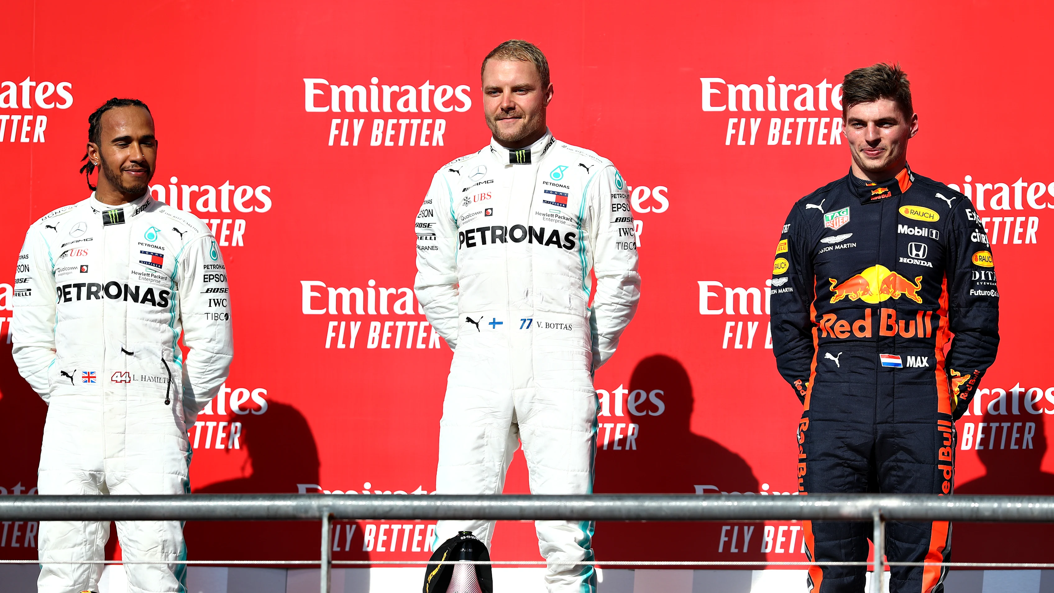 AUSTIN, TEXAS - NOVEMBER 03: Top three finishers Valtteri Bottas of Finland and Mercedes GP, Lewis