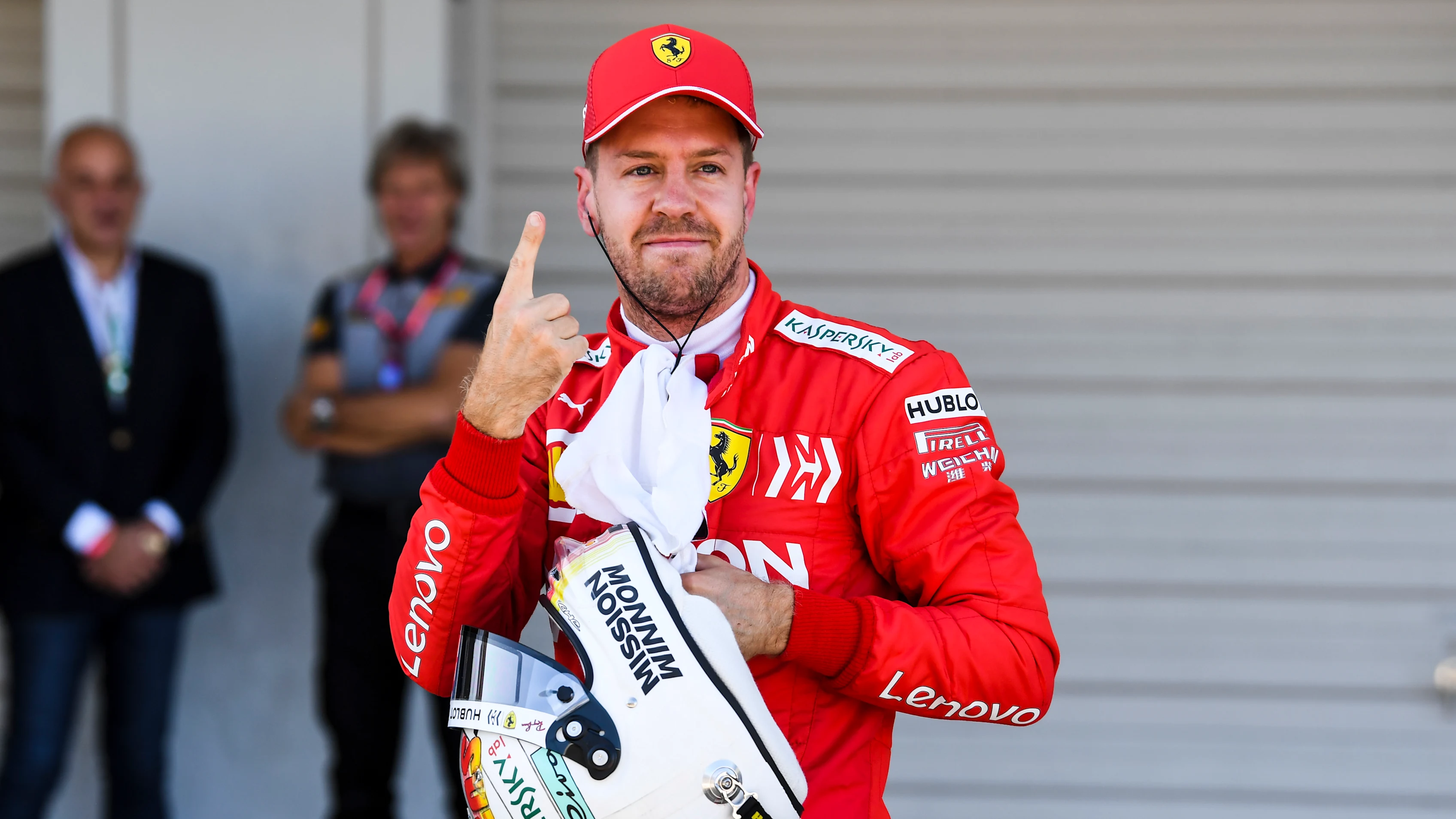 SUZUKA, JAPAN - OCTOBER 13: Pole man Sebastian Vettel, Ferrari, celebrates in Parc Ferme during the