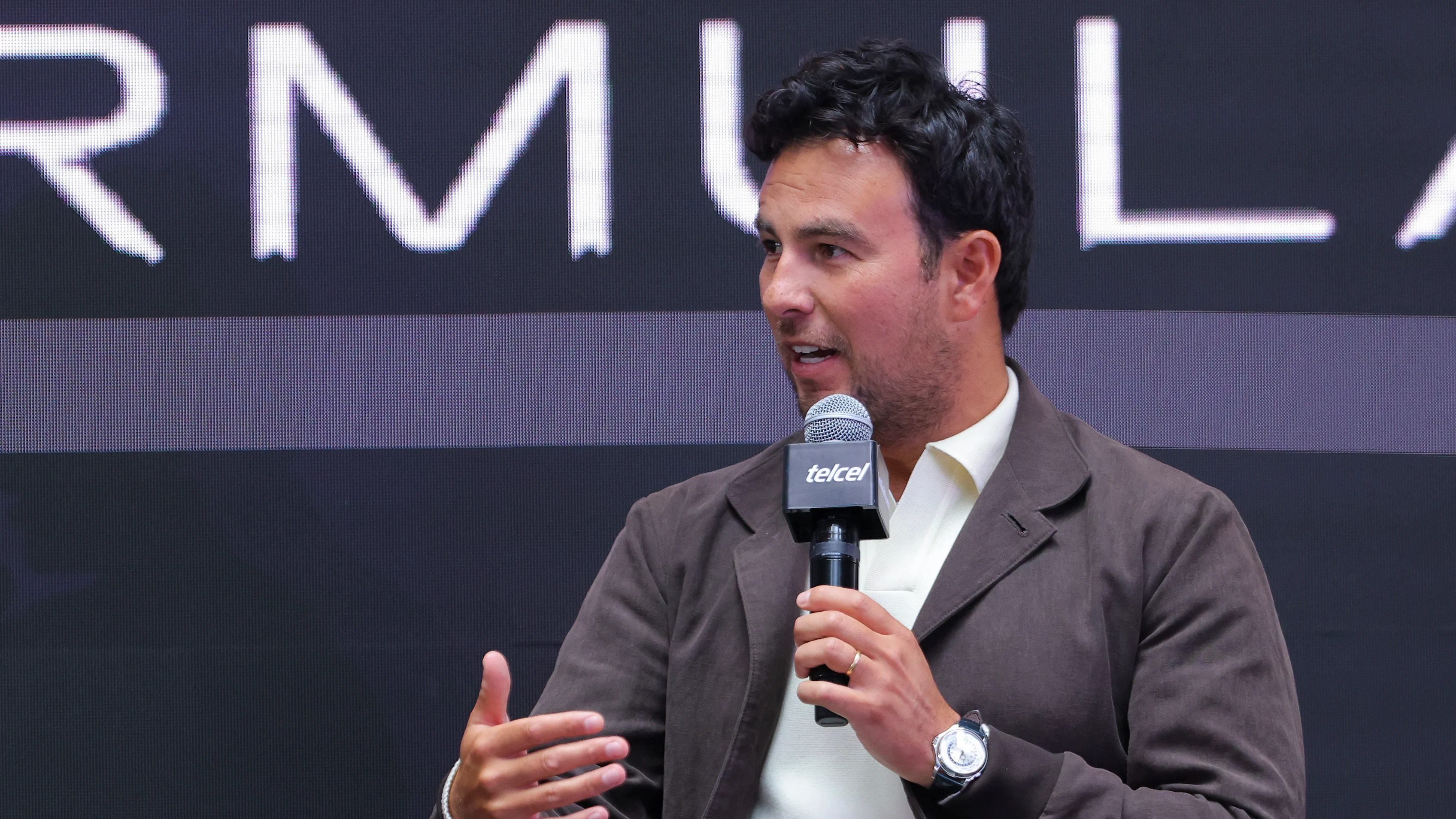 MEXICO CITY, MEXICO - AUGUST 27: Driver Sergio Perez addresses the media after announcing his