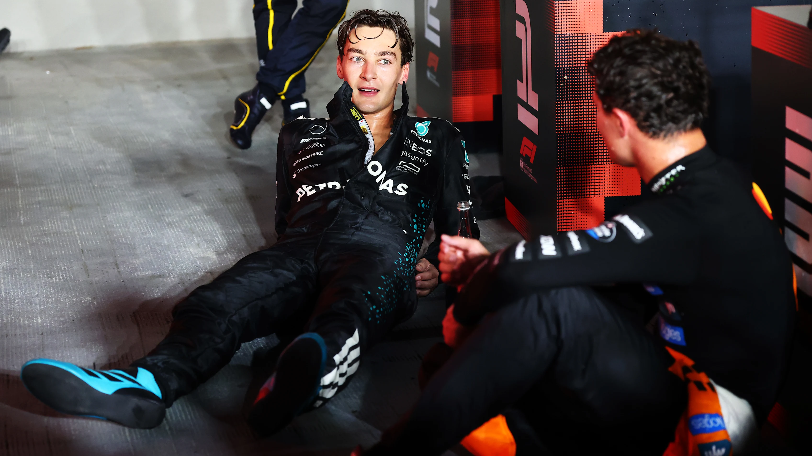 SINGAPORE, SINGAPORE - OCTOBER 05: Race winner George Russell of Great Britain and Mercedes AMG