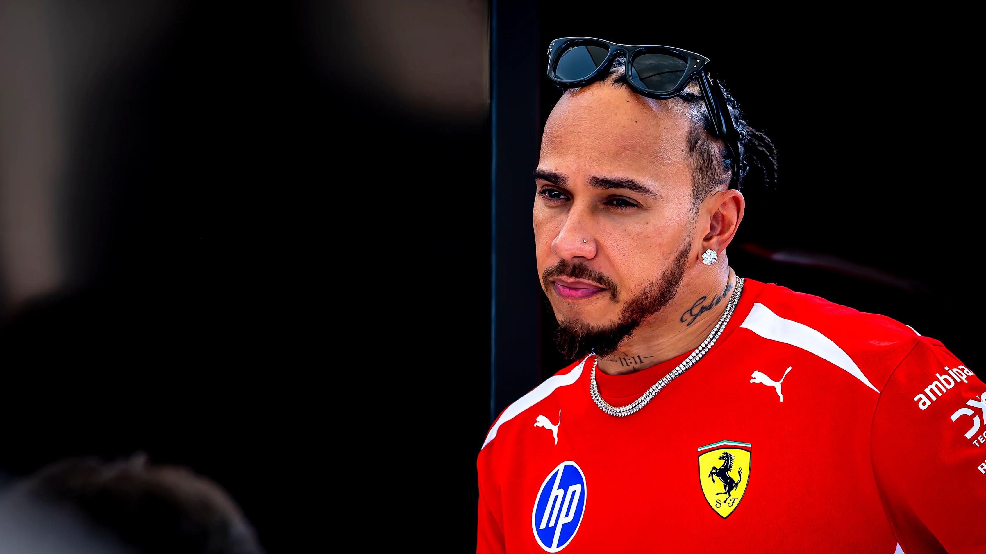 BAHRAIN, BAHRAIN - FEBRUARY 11: Lewis Hamilton of Great Britain and Scuderia Ferrari looks on