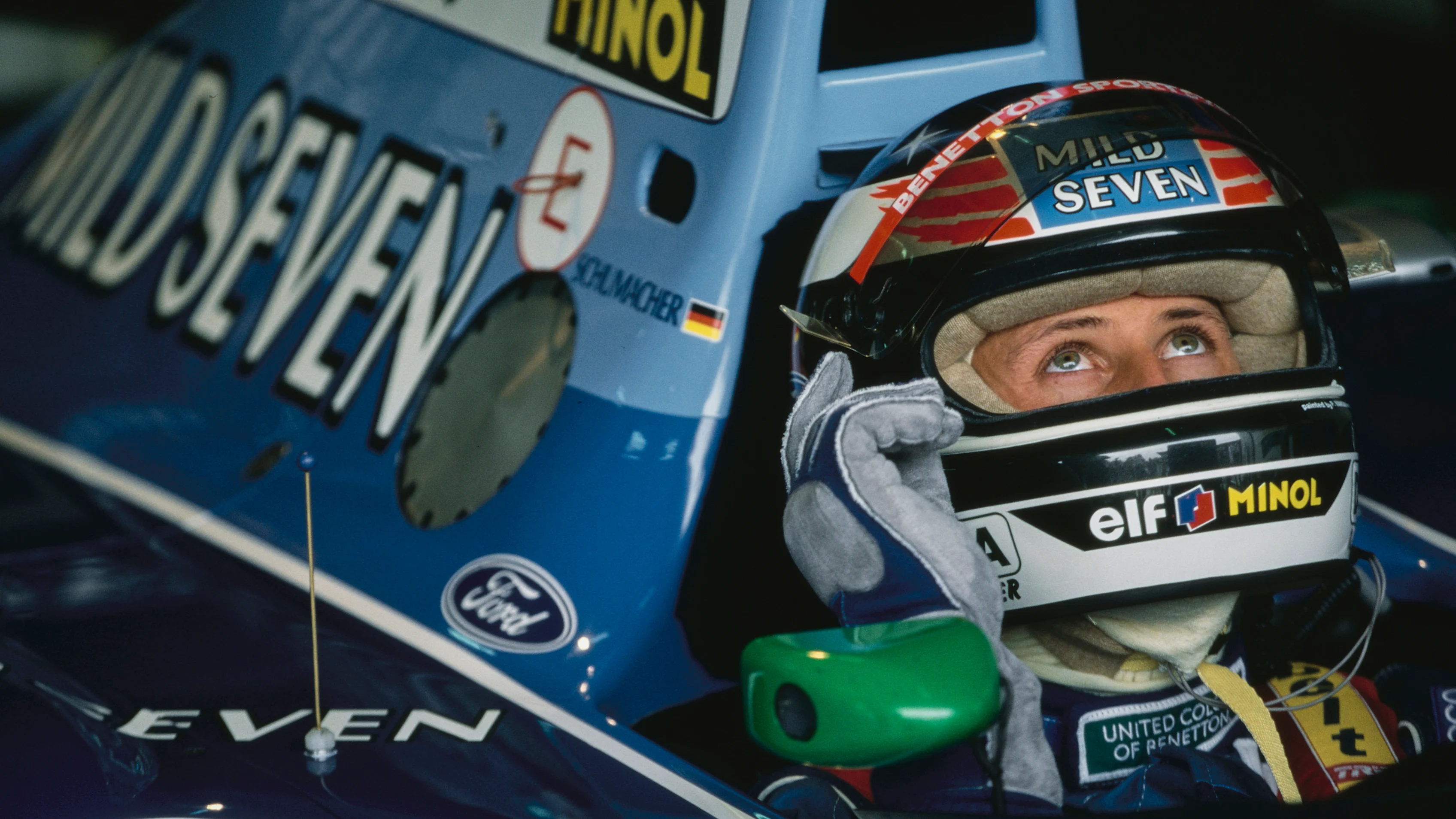 Michael Schumacher from Germany checks the lap times from the cockpit of the #5 Mild Seven Benetton