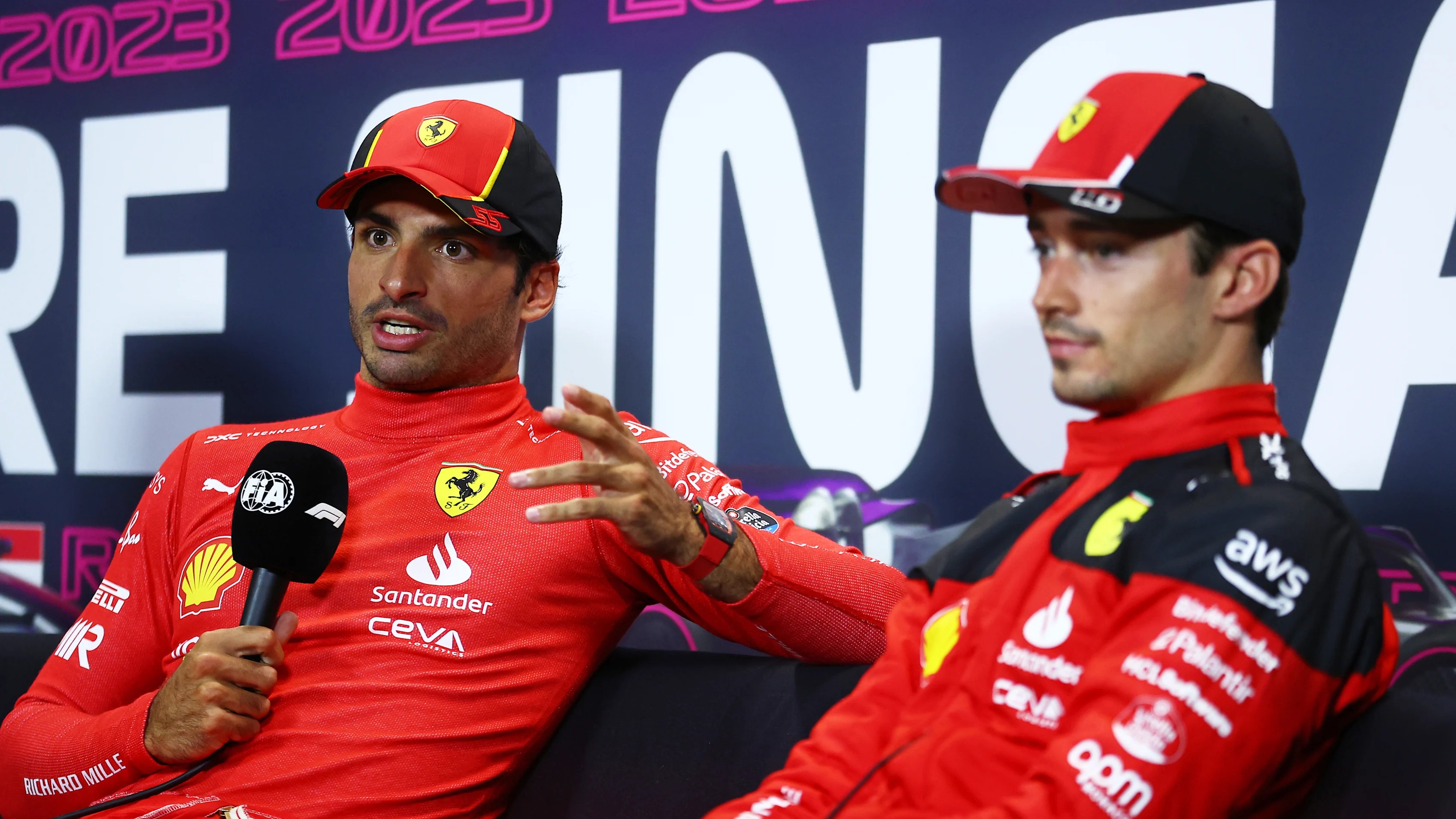 SINGAPORE, SINGAPORE - SEPTEMBER 16: Pole position qualifier Carlos Sainz of Spain and Ferrari