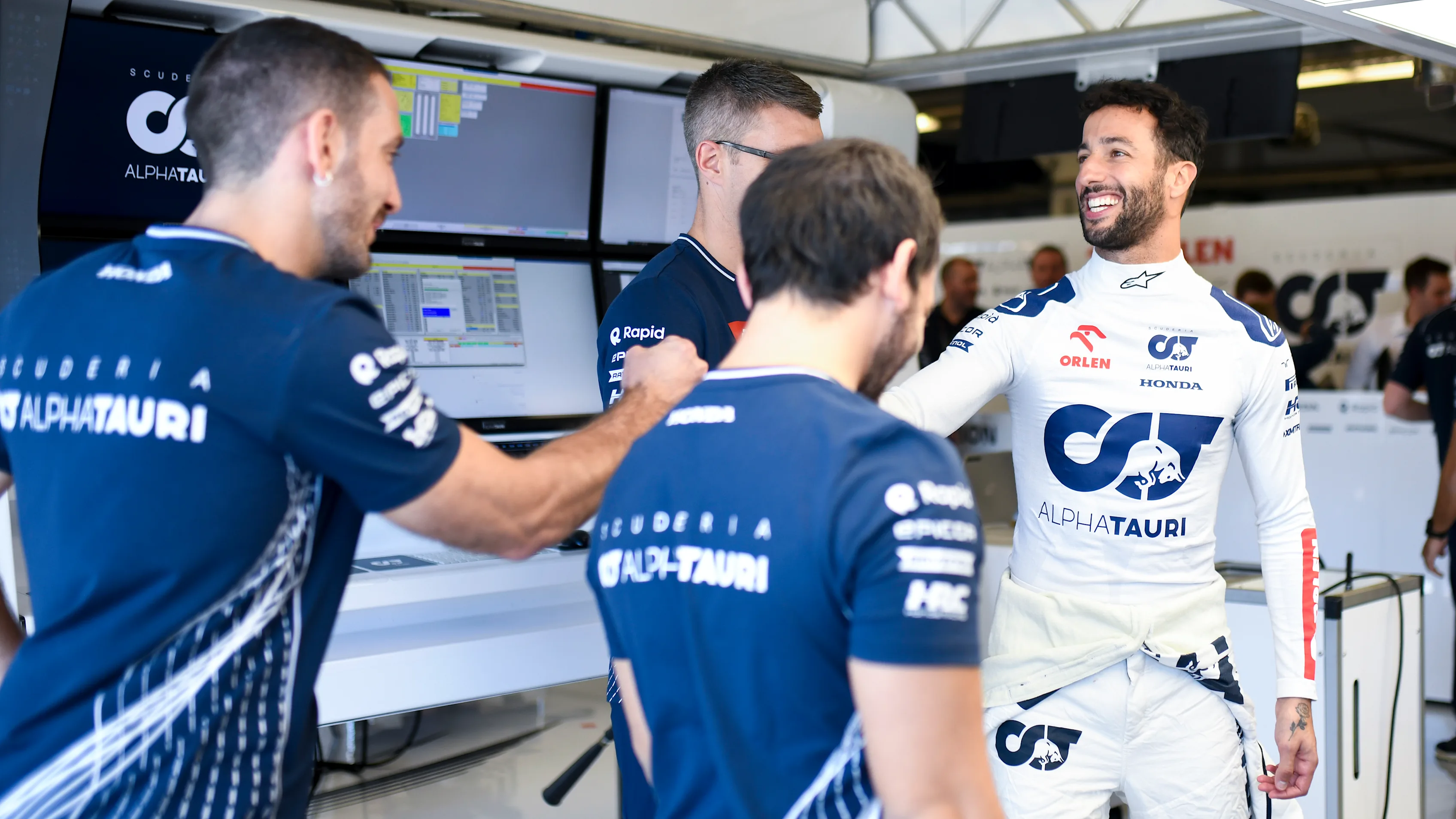 AUSTIN, TEXAS - OCTOBER 19: Daniel Ricciardo of Australia and Scuderia AlphaTauri talks with his