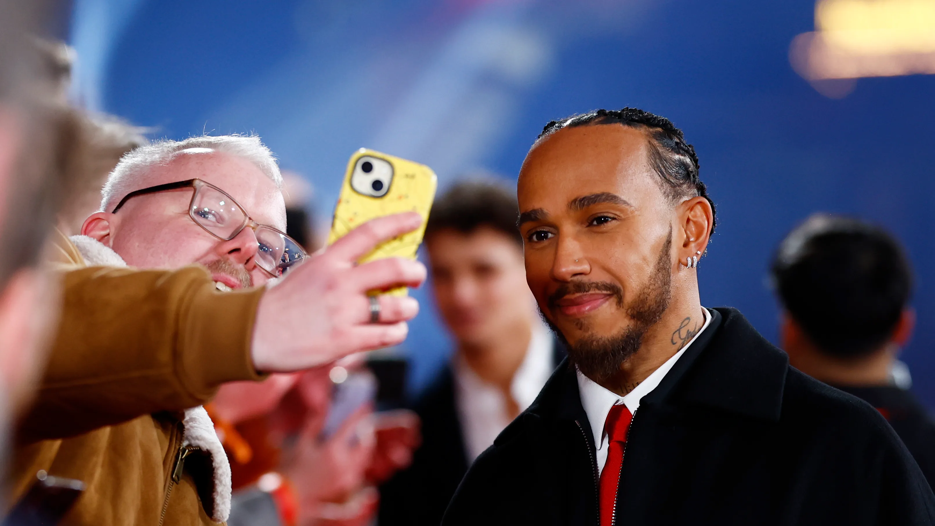 LONDON, ENGLAND - FEBRUARY 18: Lewis Hamilton of Great Britain and Scuderia Ferrari greets fans as