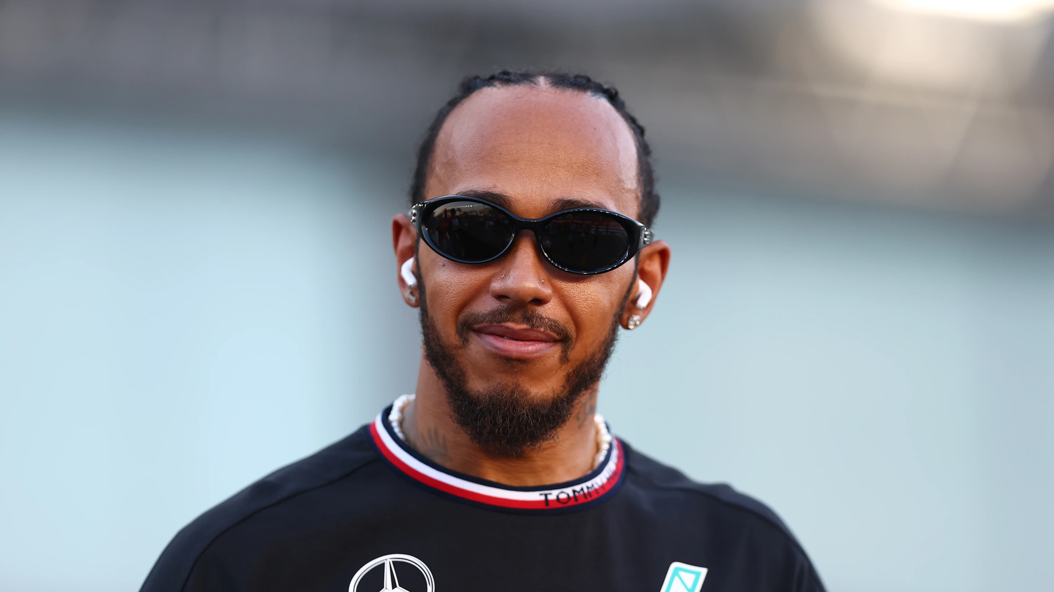 SINGAPORE, SINGAPORE - SEPTEMBER 22: Lewis Hamilton of Great Britain and Mercedes looks on from the