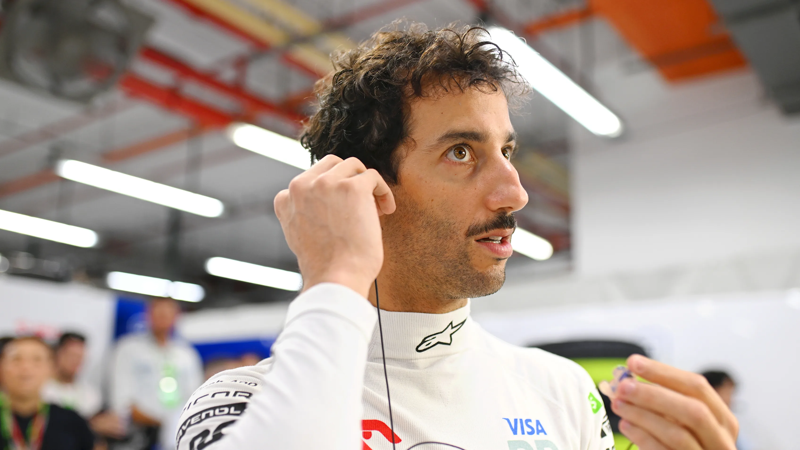 SINGAPORE, SINGAPORE - SEPTEMBER 22: Daniel Ricciardo of Australia and Visa Cash App RB prepares in