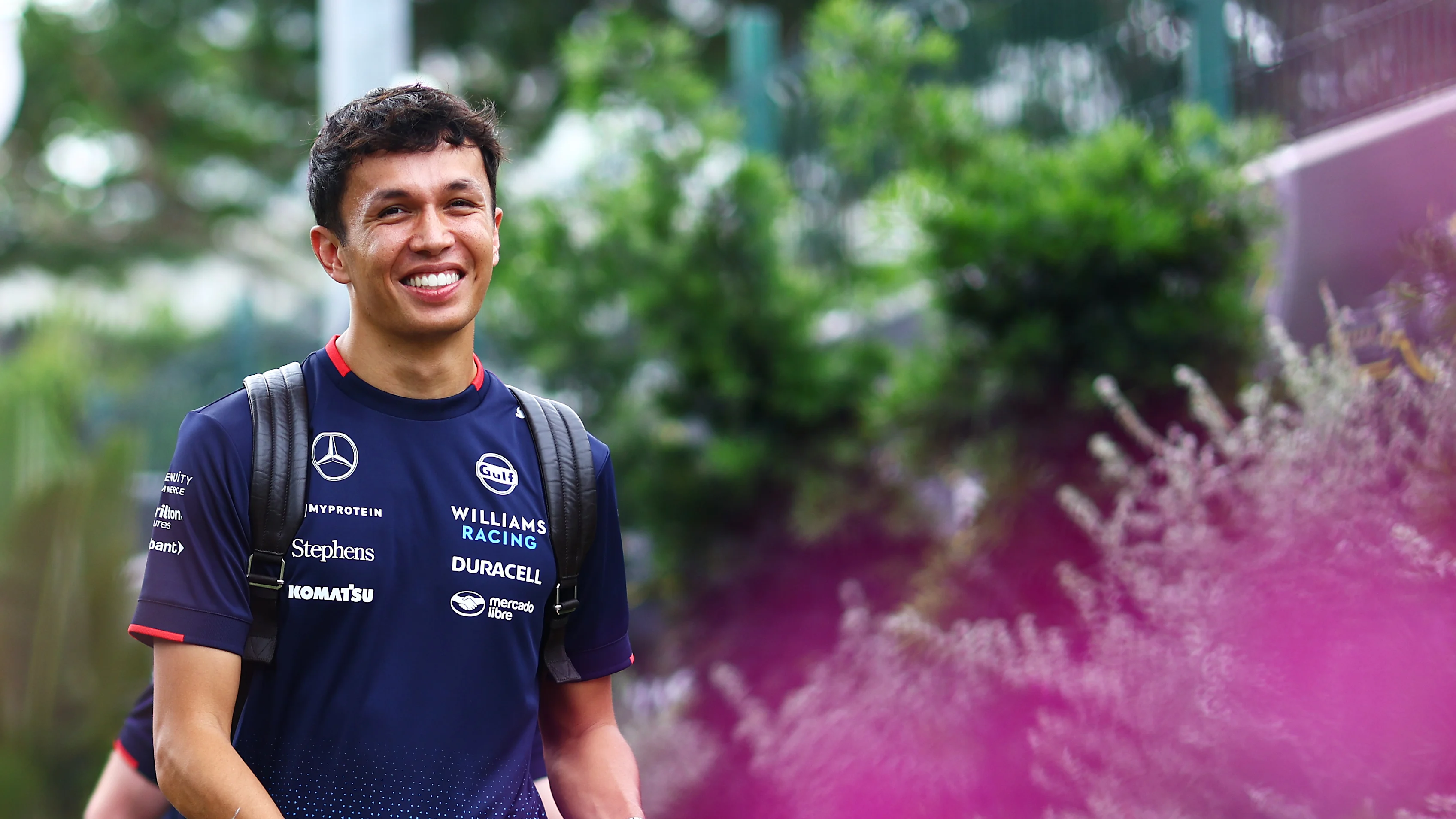 SINGAPORE, SINGAPORE - SEPTEMBER 19: Alexander Albon of Thailand and Williams walks in the Paddock