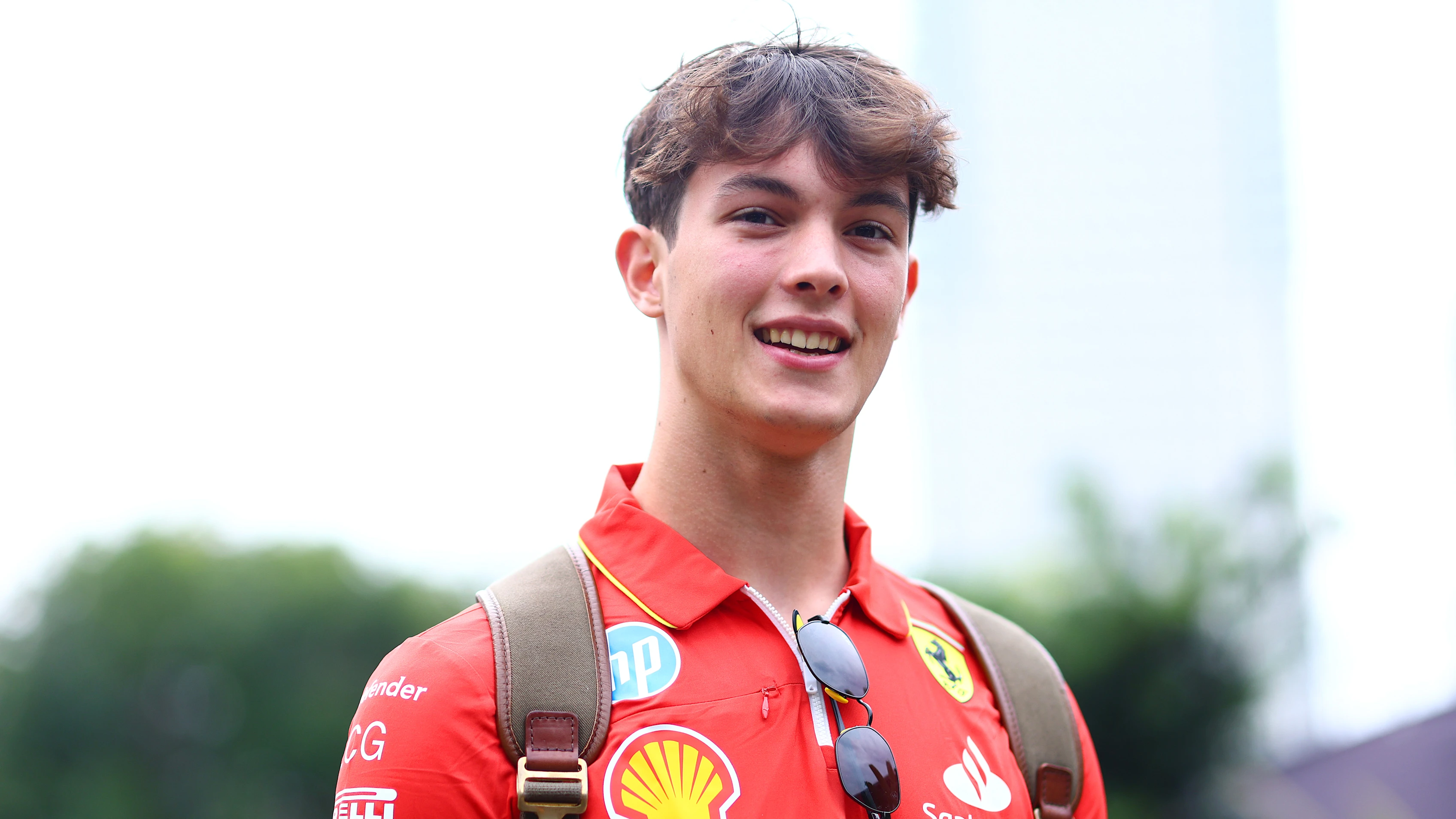 SINGAPORE, SINGAPORE - SEPTEMBER 19: Oliver Bearman of Great Britain and Ferrari walks in the