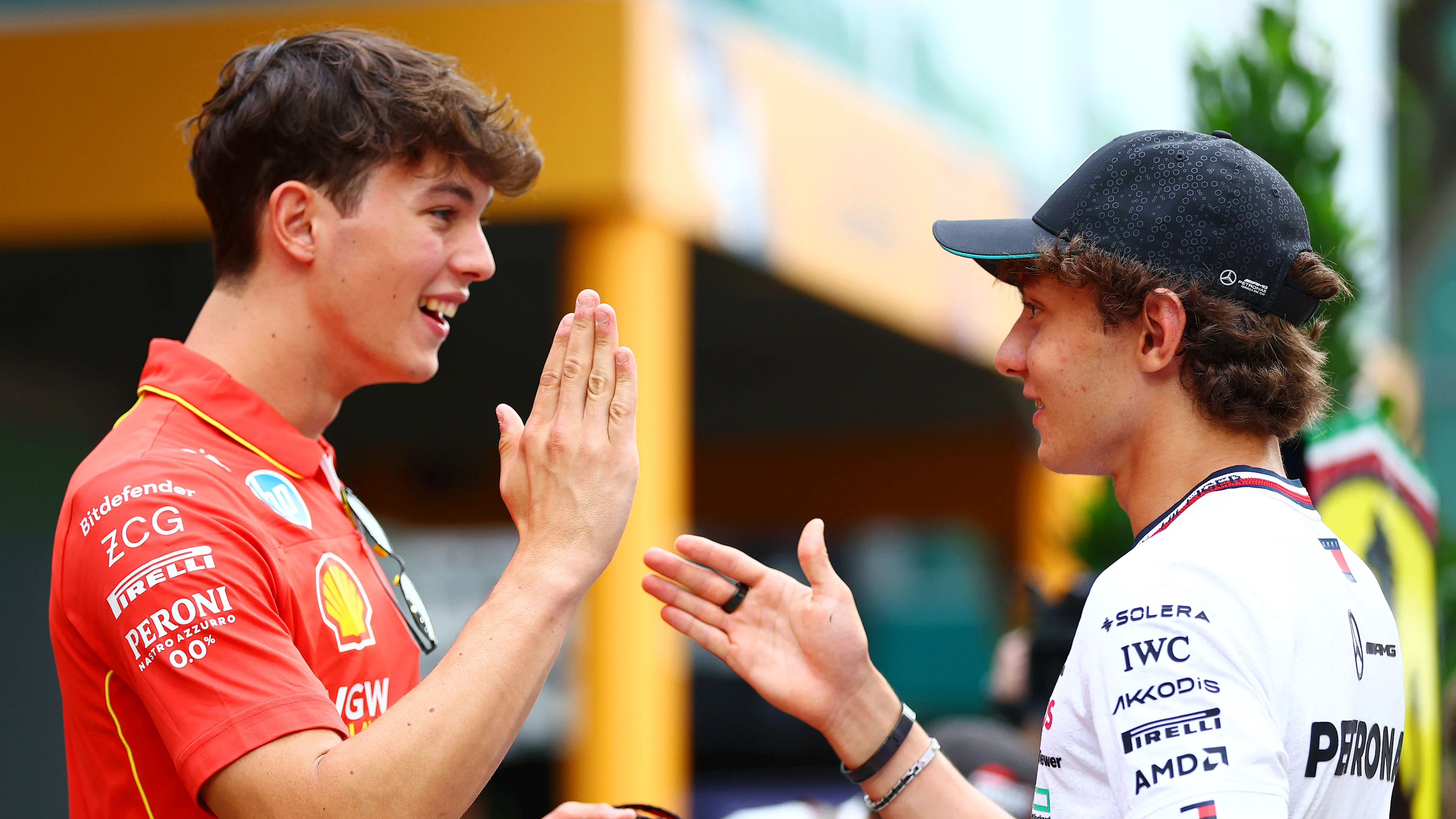 SINGAPORE, SINGAPORE - SEPTEMBER 19: Oliver Bearman of Great Britain and Ferrari and Andrea Kimi