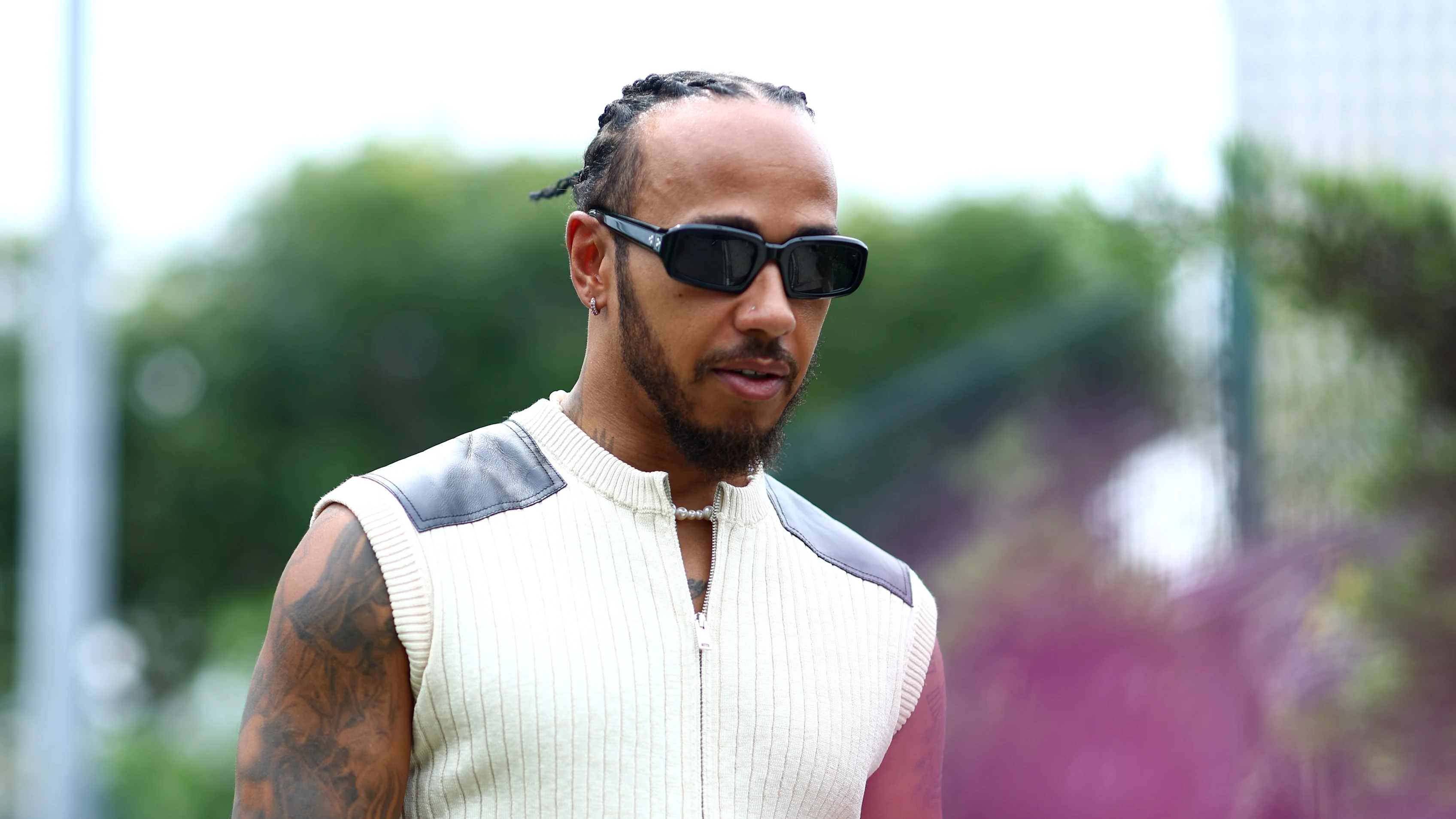 SINGAPORE, SINGAPORE - SEPTEMBER 21: Lewis Hamilton of Great Britain and Mercedes walks in the