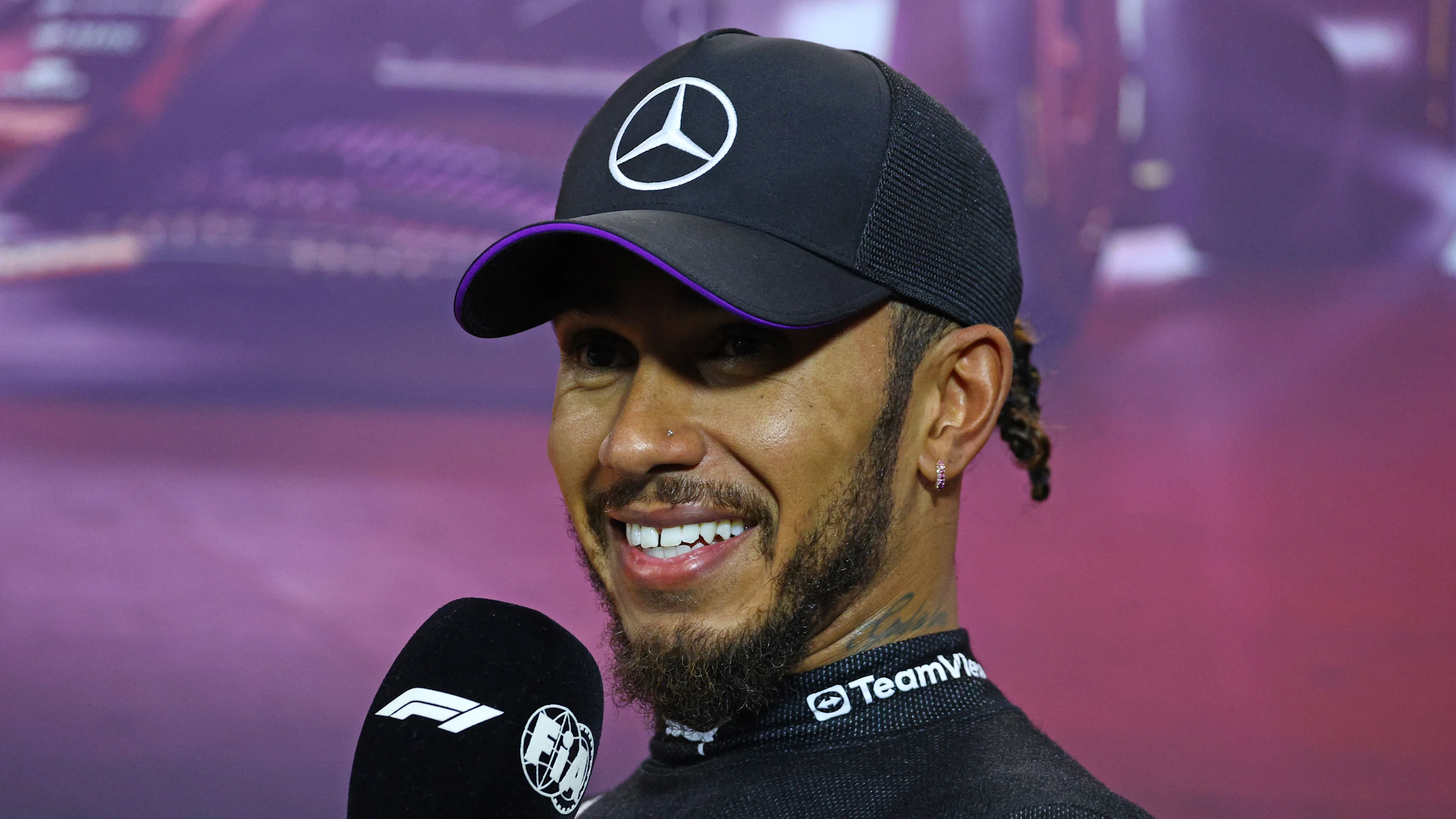 SINGAPORE, SINGAPORE - SEPTEMBER 21: Third placed qualifier Lewis Hamilton of Great Britain and