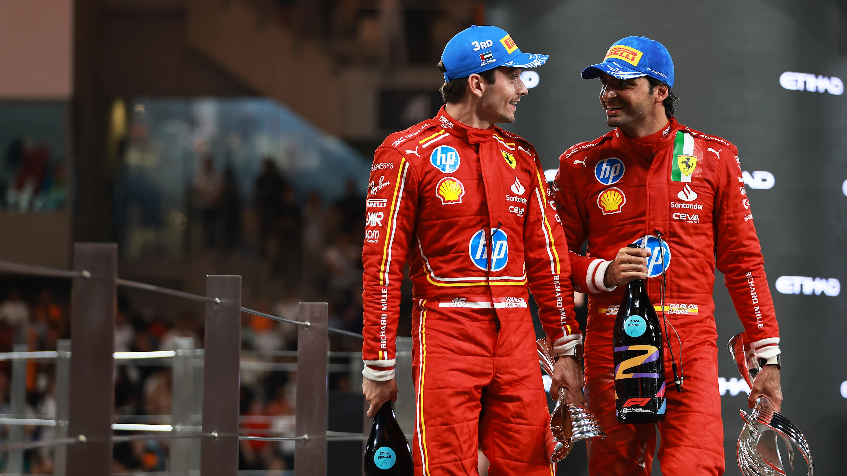 ABU DHABI, UNITED ARAB EMIRATES - DECEMBER 08: Second placed Carlos Sainz of Spain and Ferrari and