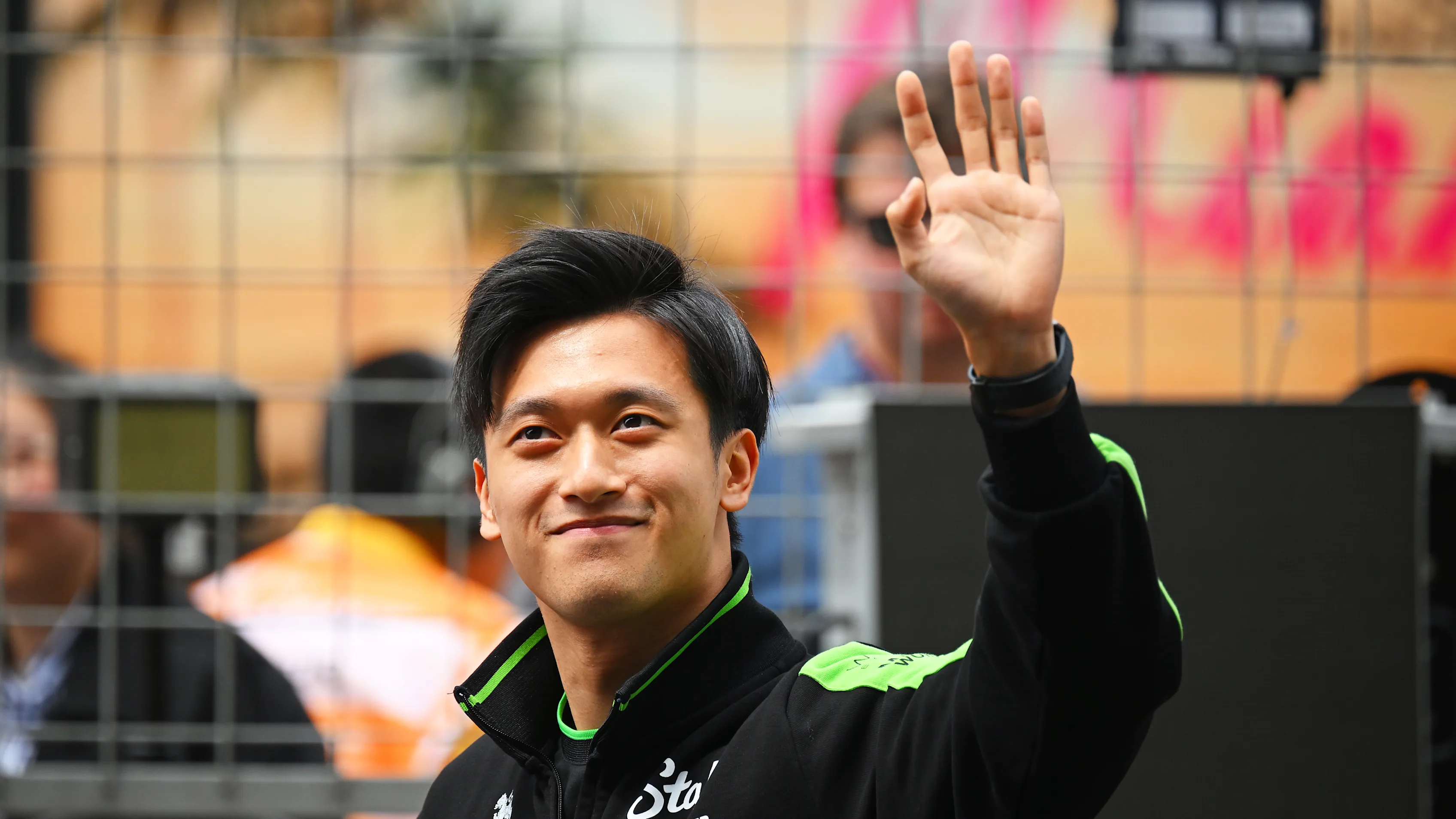 SHANGHAI, CHINA - APRIL 21: Zhou Guanyu of China and Stake F1 Team Kick Sauber waves to the crowd