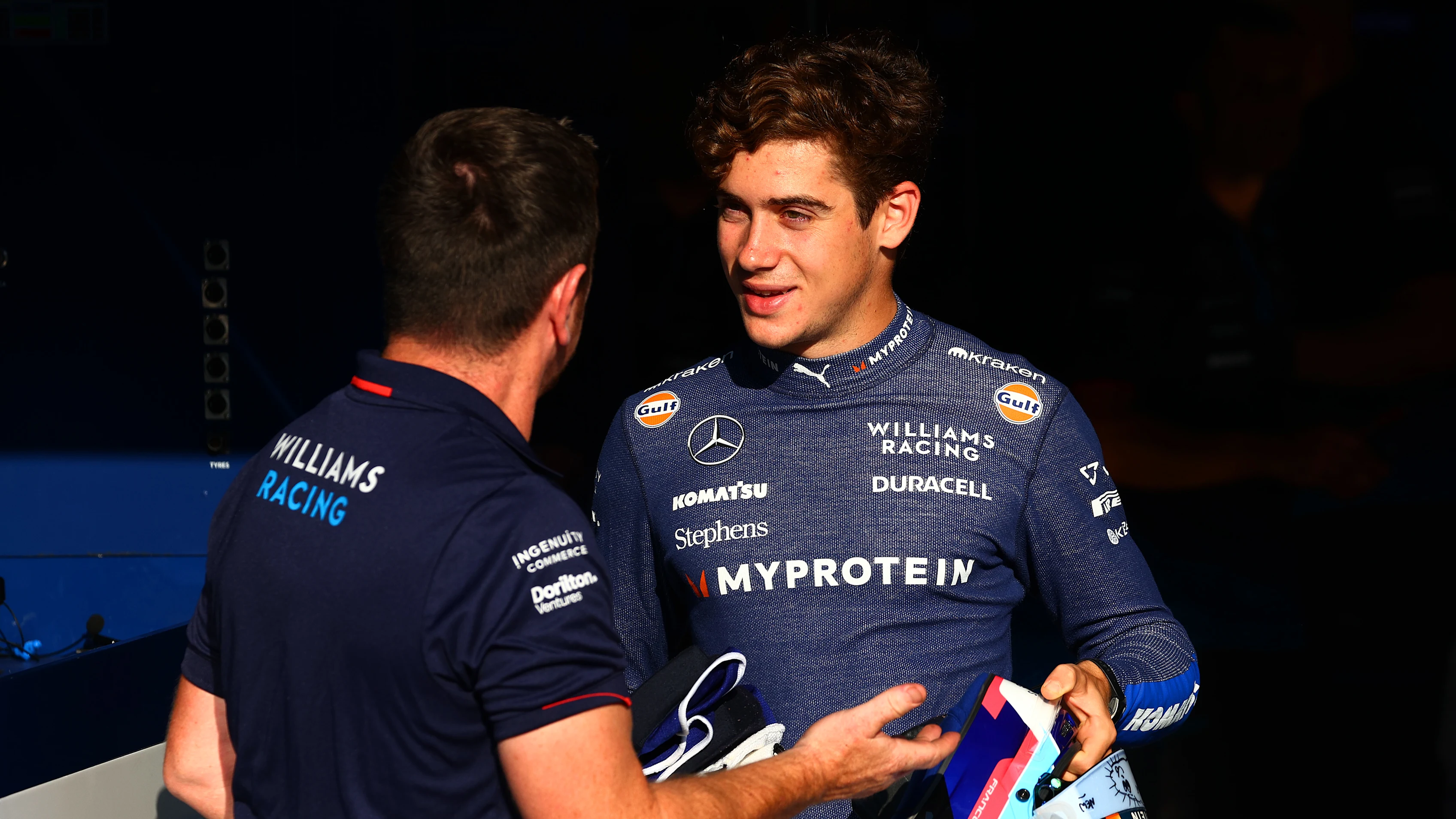 MONZA, ITALY - AUGUST 29: Franco Colapinto of Argentina and Williams talks with a Williams team