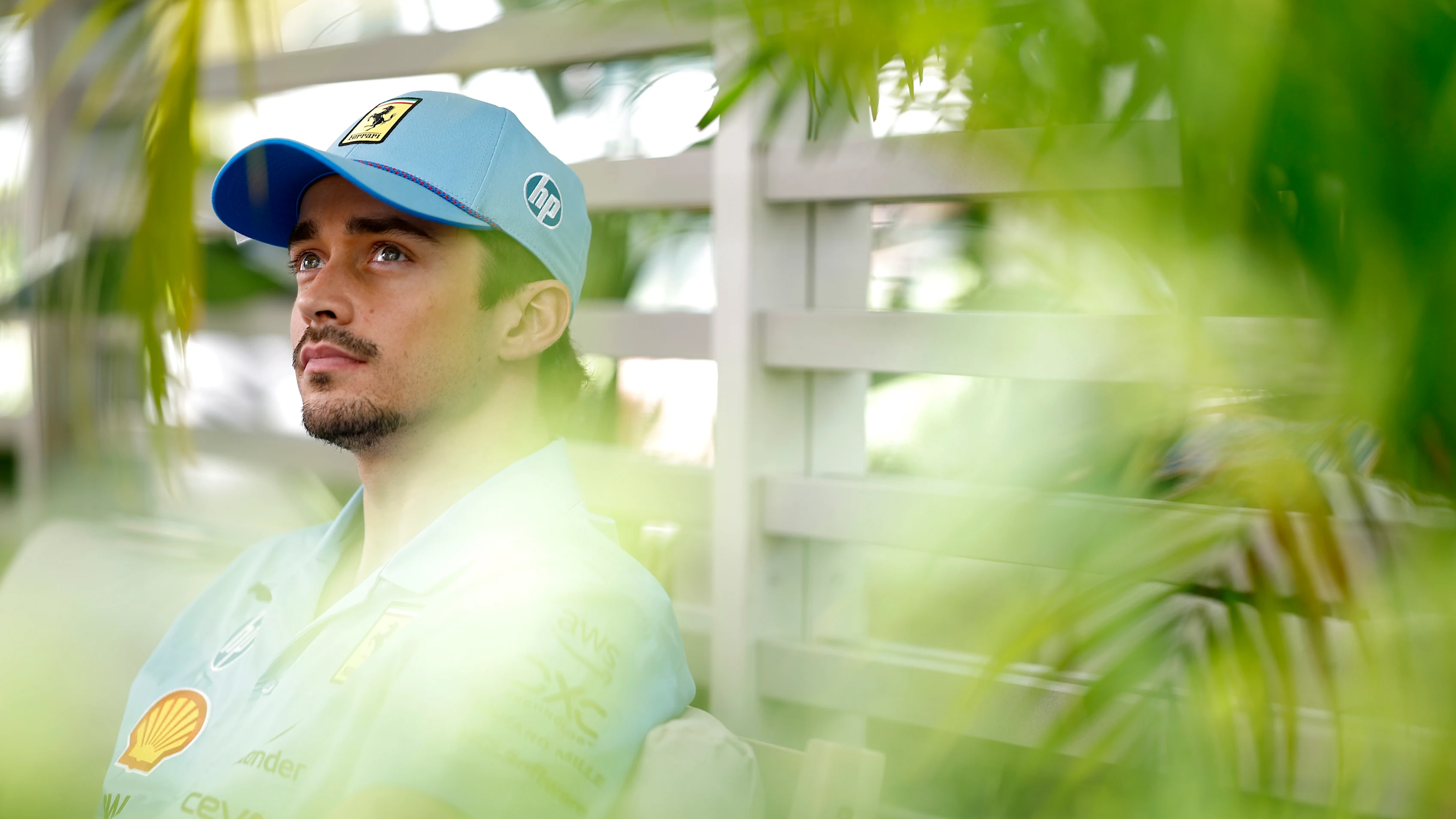 MIAMI, FLORIDA - MAY 02: Charles Leclerc of Monaco and Ferrari talks to the media in the Paddock