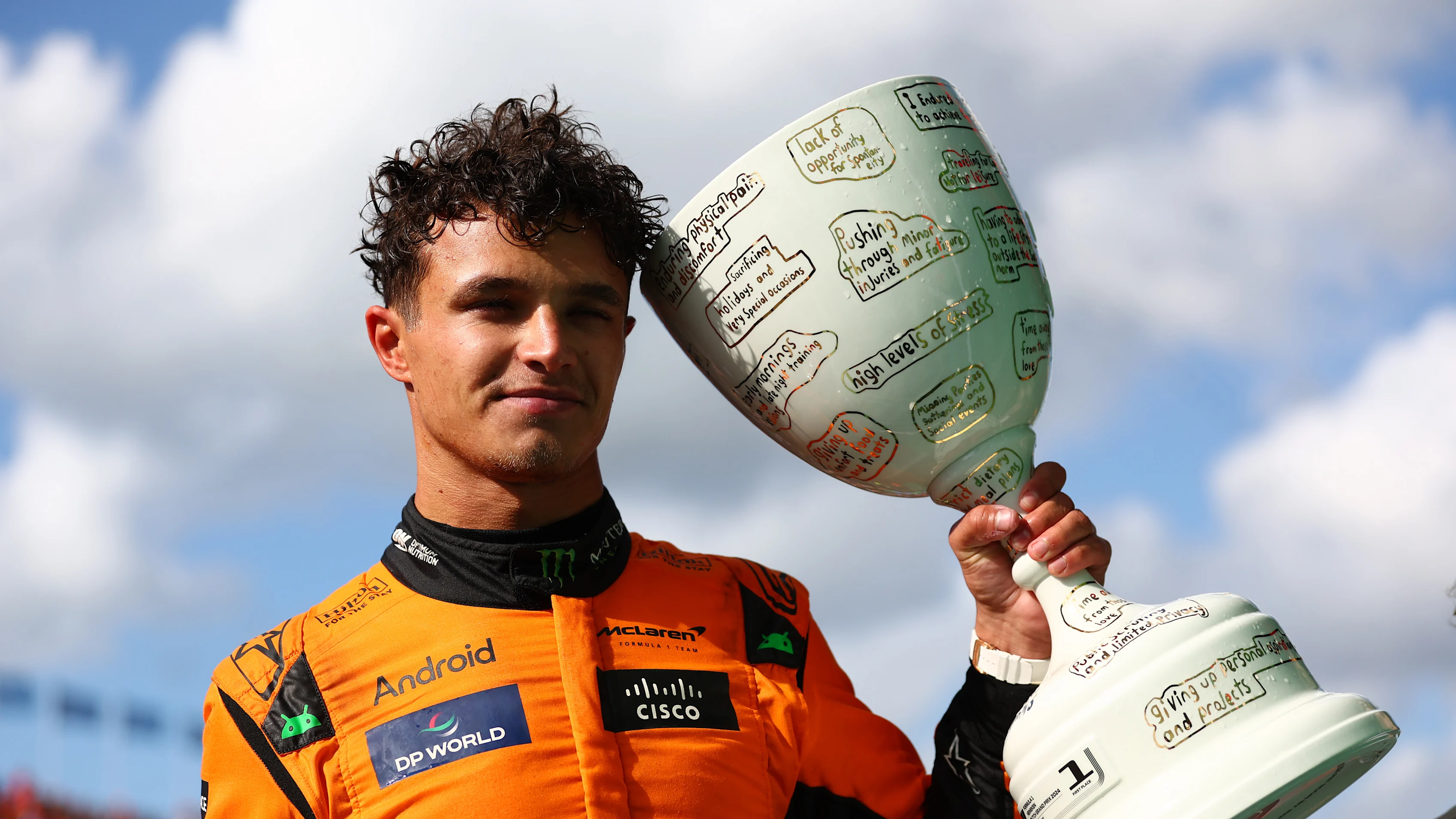 ZANDVOORT, NETHERLANDS - AUGUST 25: Race winner Lando Norris of Great Britain and McLaren poses for