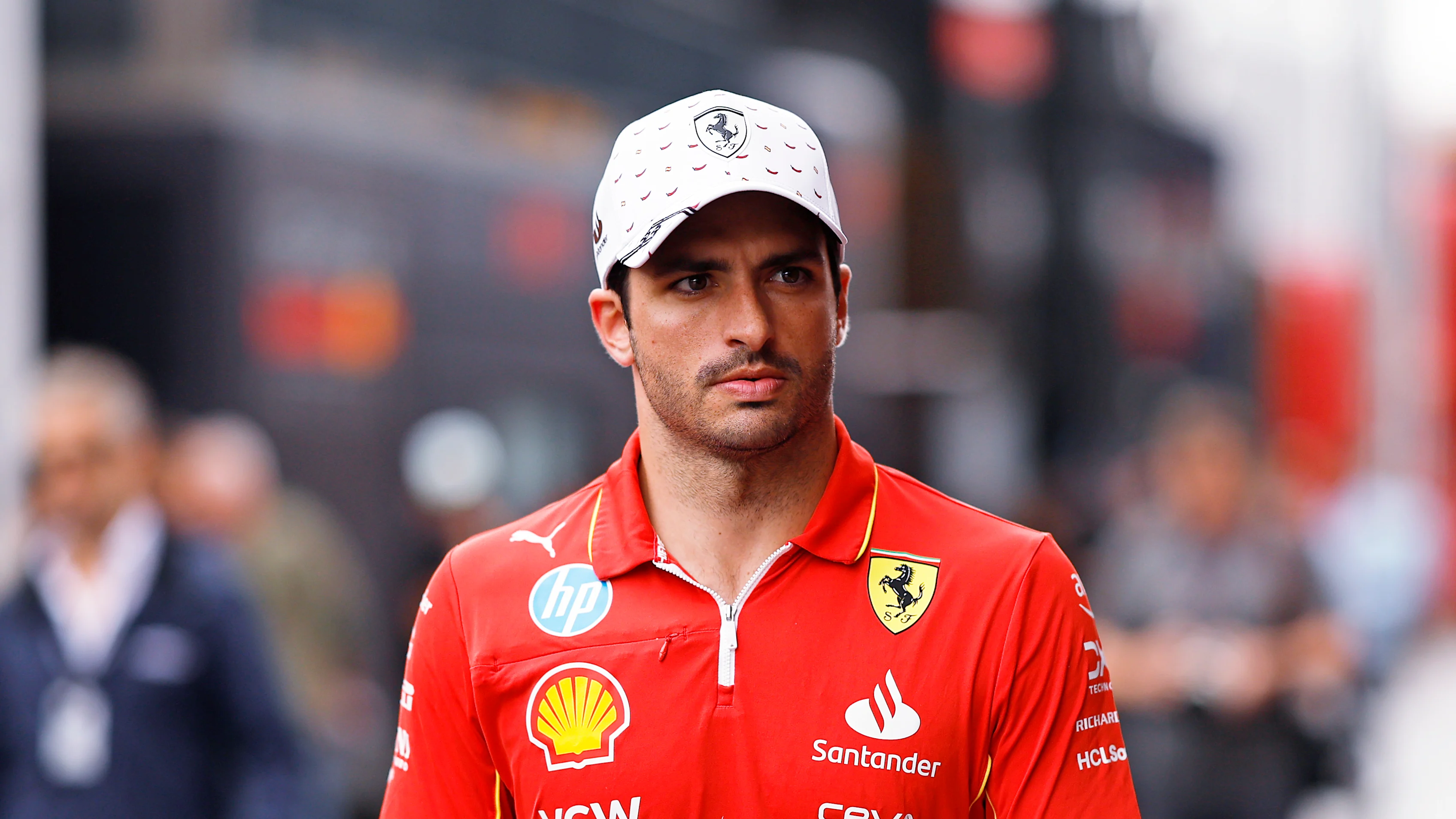 BARCELONA, SPAIN - JUNE 20: Carlos Sainz of Spain and Ferrari walks in the Paddock during previews