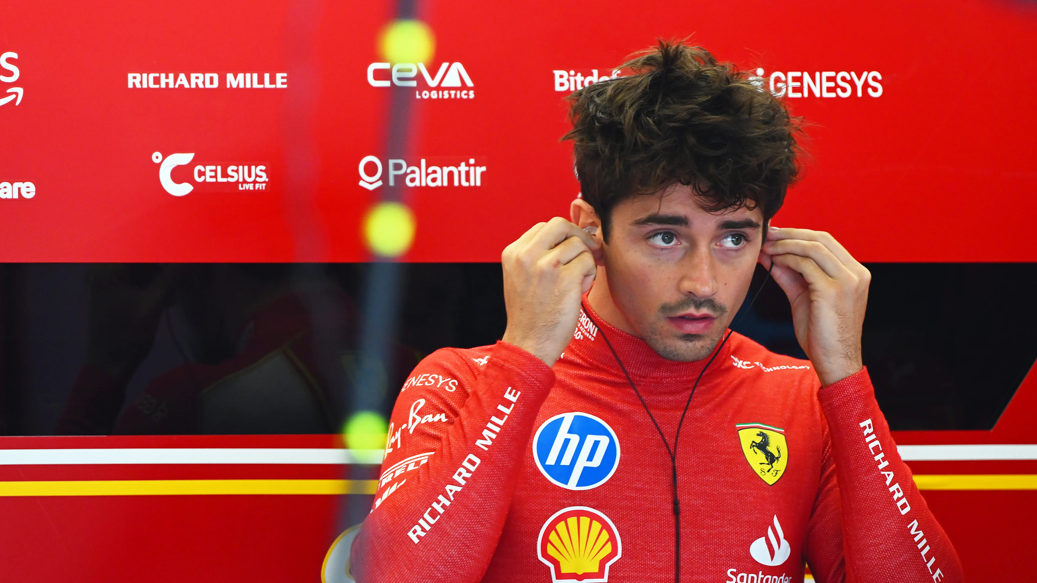 AUSTIN, TEXAS - OCTOBER 18: Charles Leclerc of Monaco and Ferrari prepares to drive in the garage