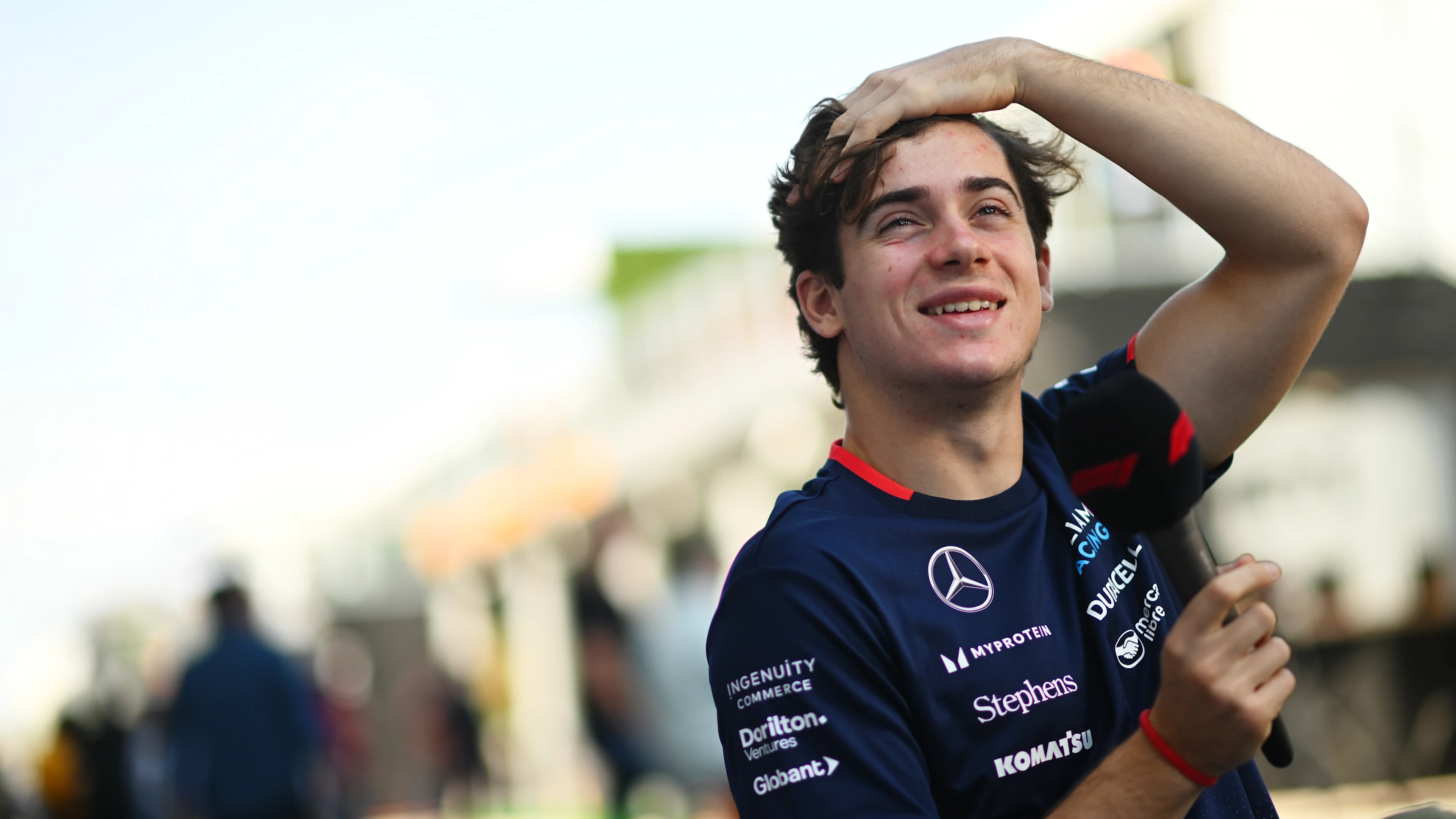 AUSTIN, TEXAS - OCTOBER 17: Franco Colapinto of Argentina and Williams talks to the media in the