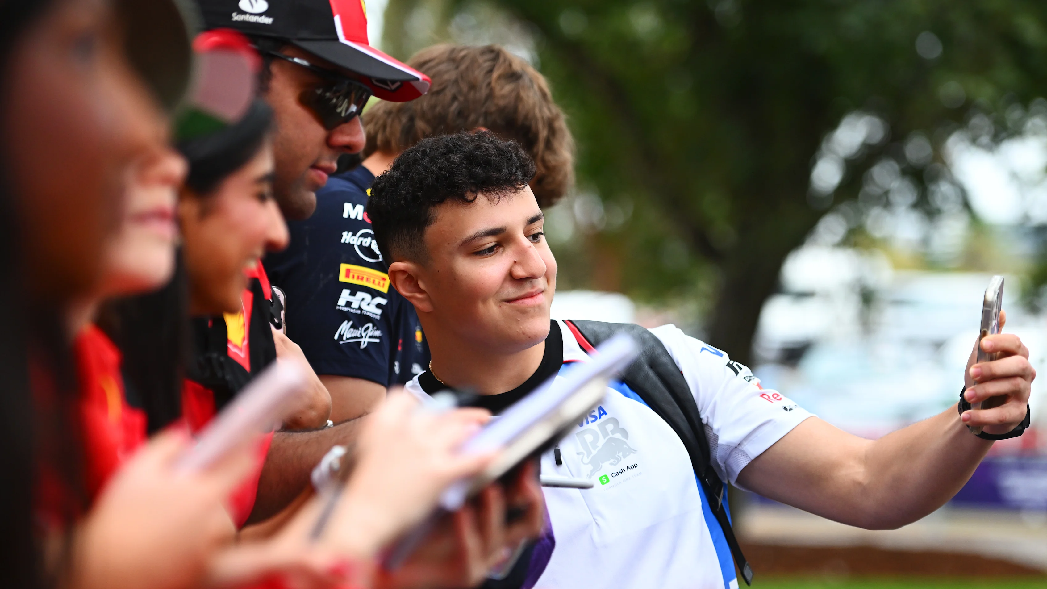 MELBOURNE, AUSTRALIA - MARCH 13: Isack Hadjar of France and Visa Cash App Racing Bulls meets some